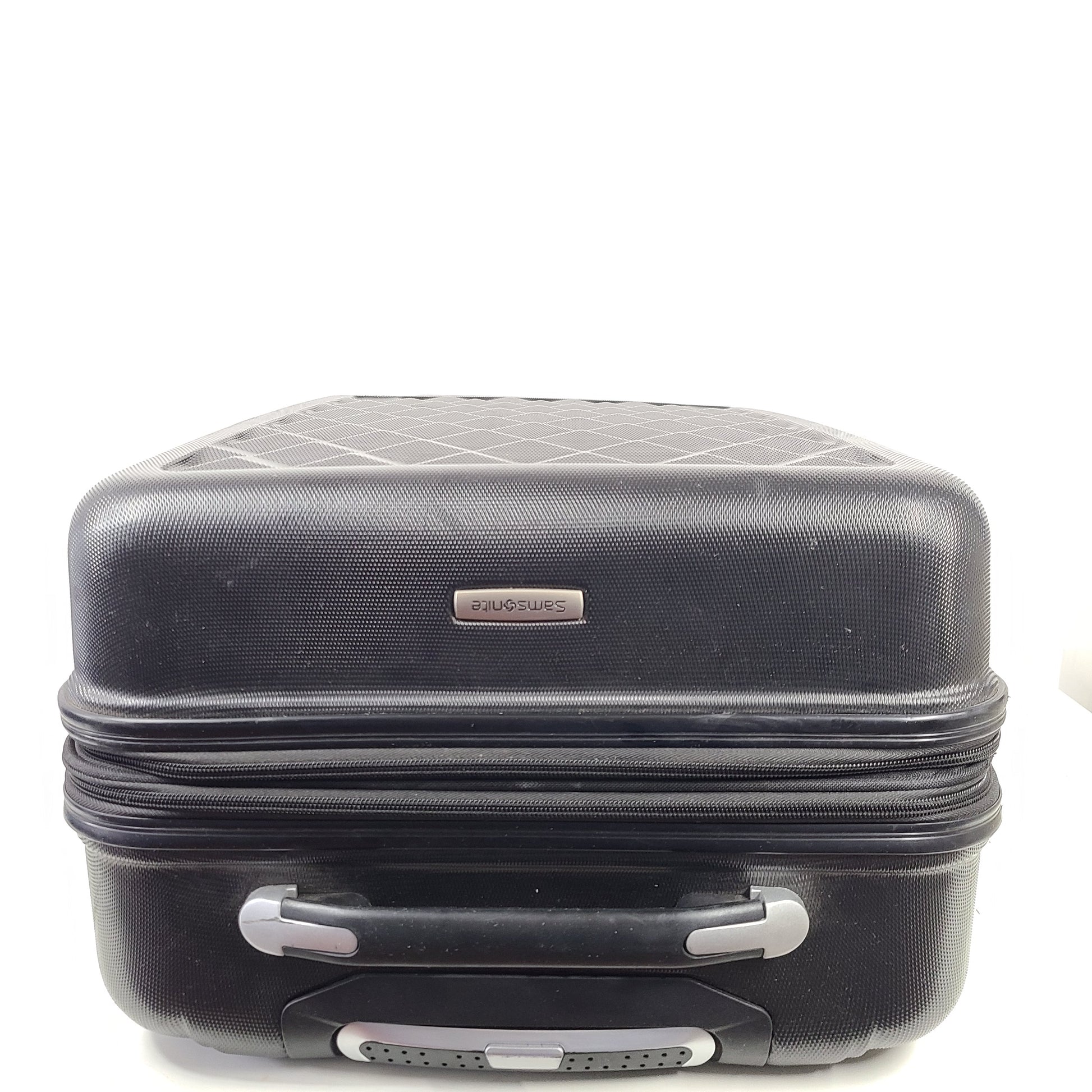 Black Samsonite suitcase model 5000230 with light scuff marks and a clean interior.