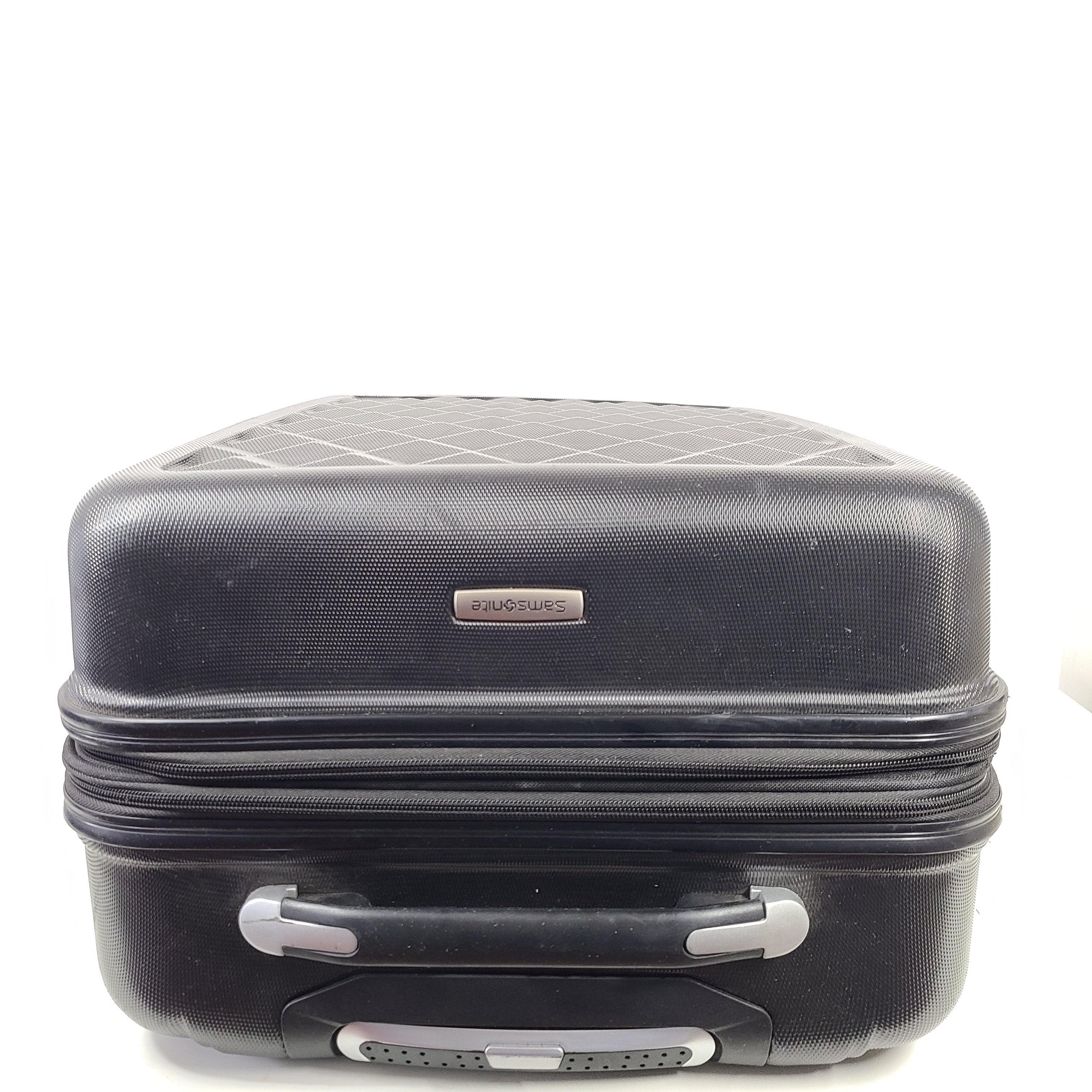 Black Samsonite suitcase model 5000230 with light scuff marks and a clean interior.