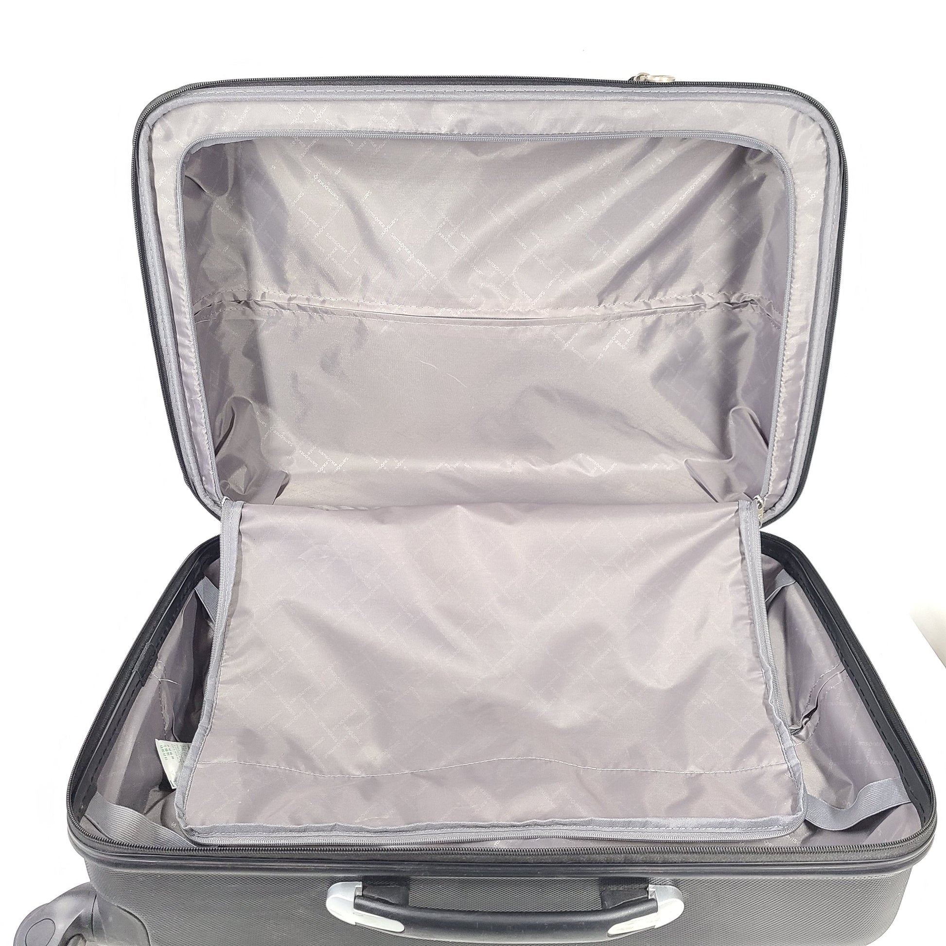 Black Samsonite suitcase model 5000230 with light scuff marks and a clean interior.