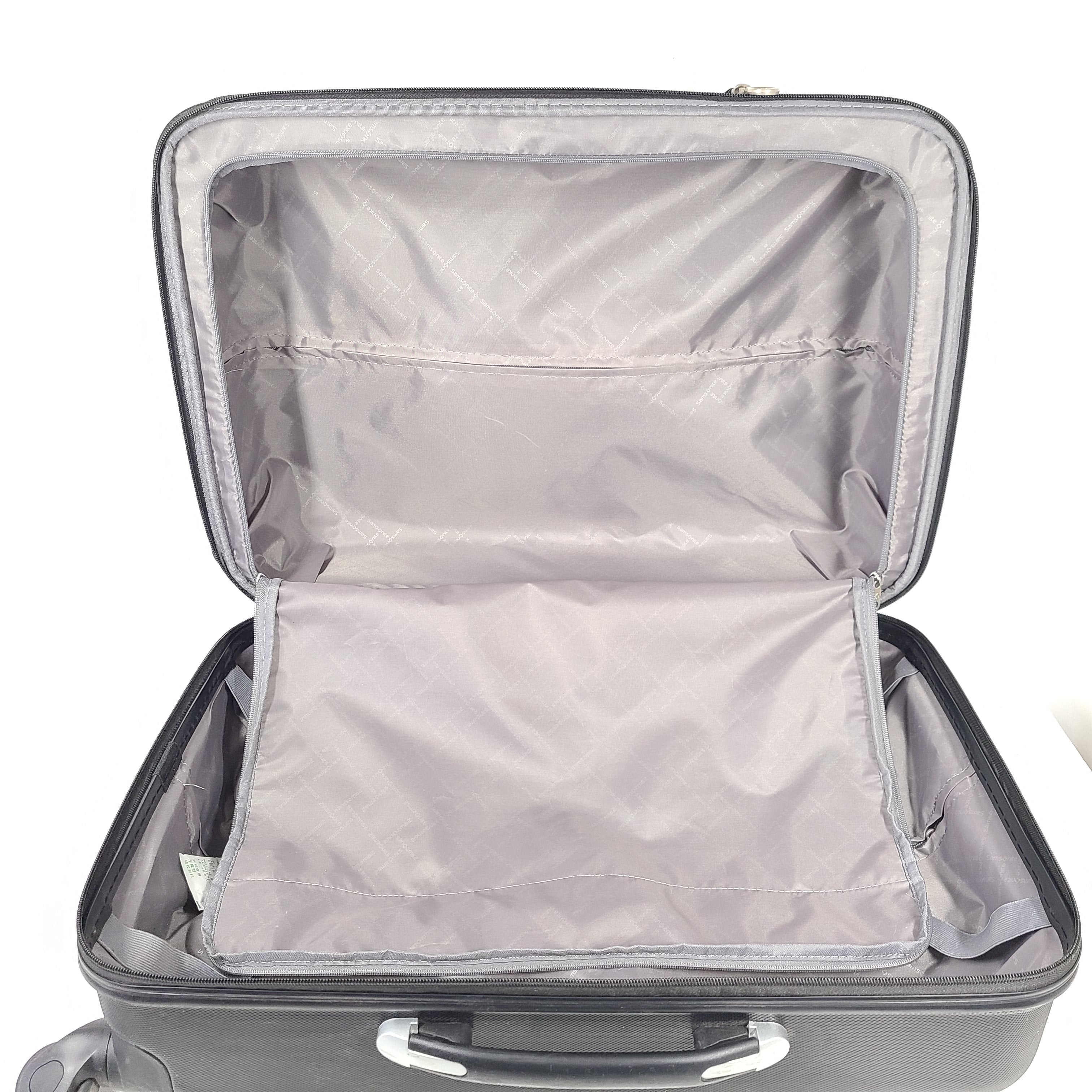 Black Samsonite suitcase model 5000230 with light scuff marks and a clean interior.