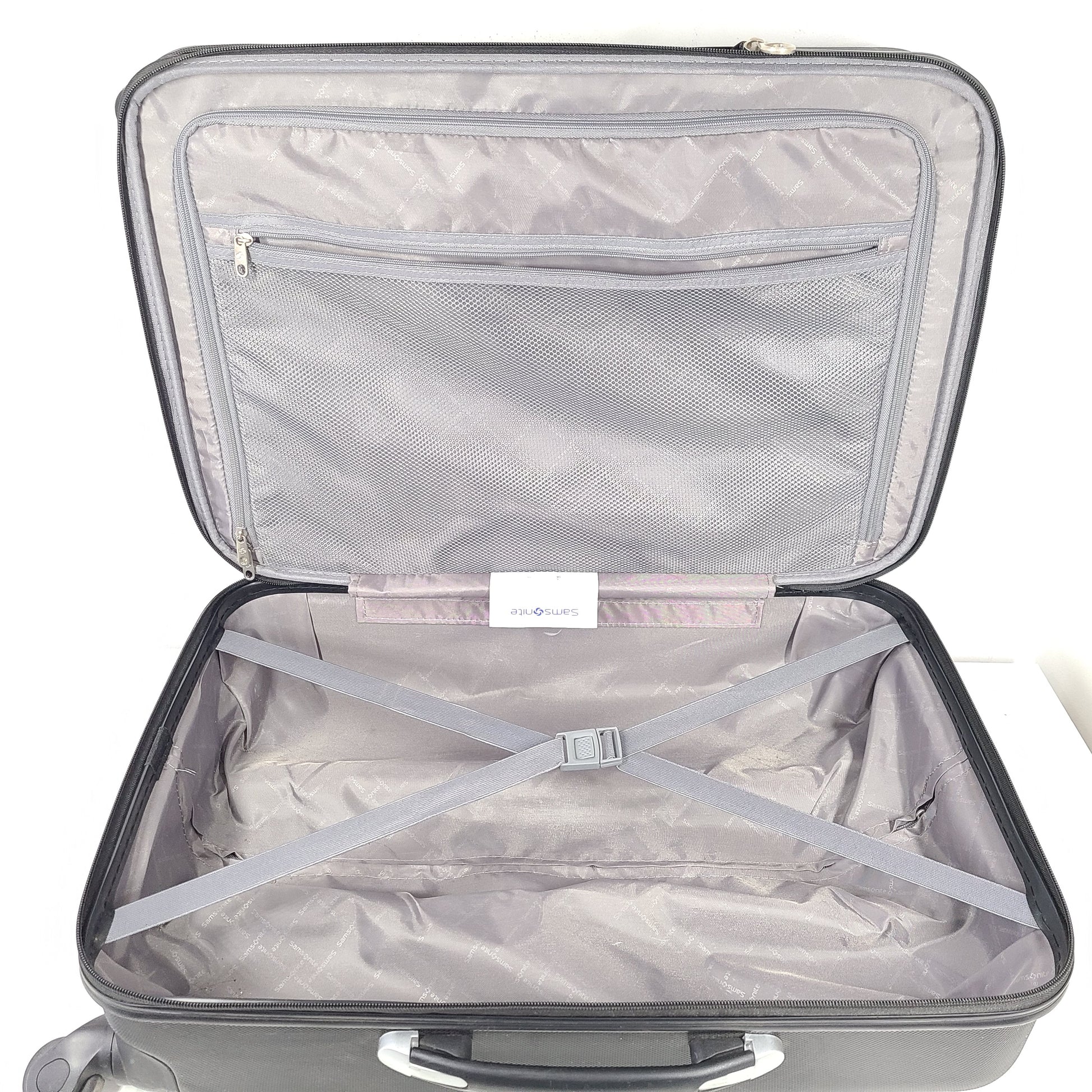 Black Samsonite suitcase model 5000230 with light scuff marks and a clean interior.