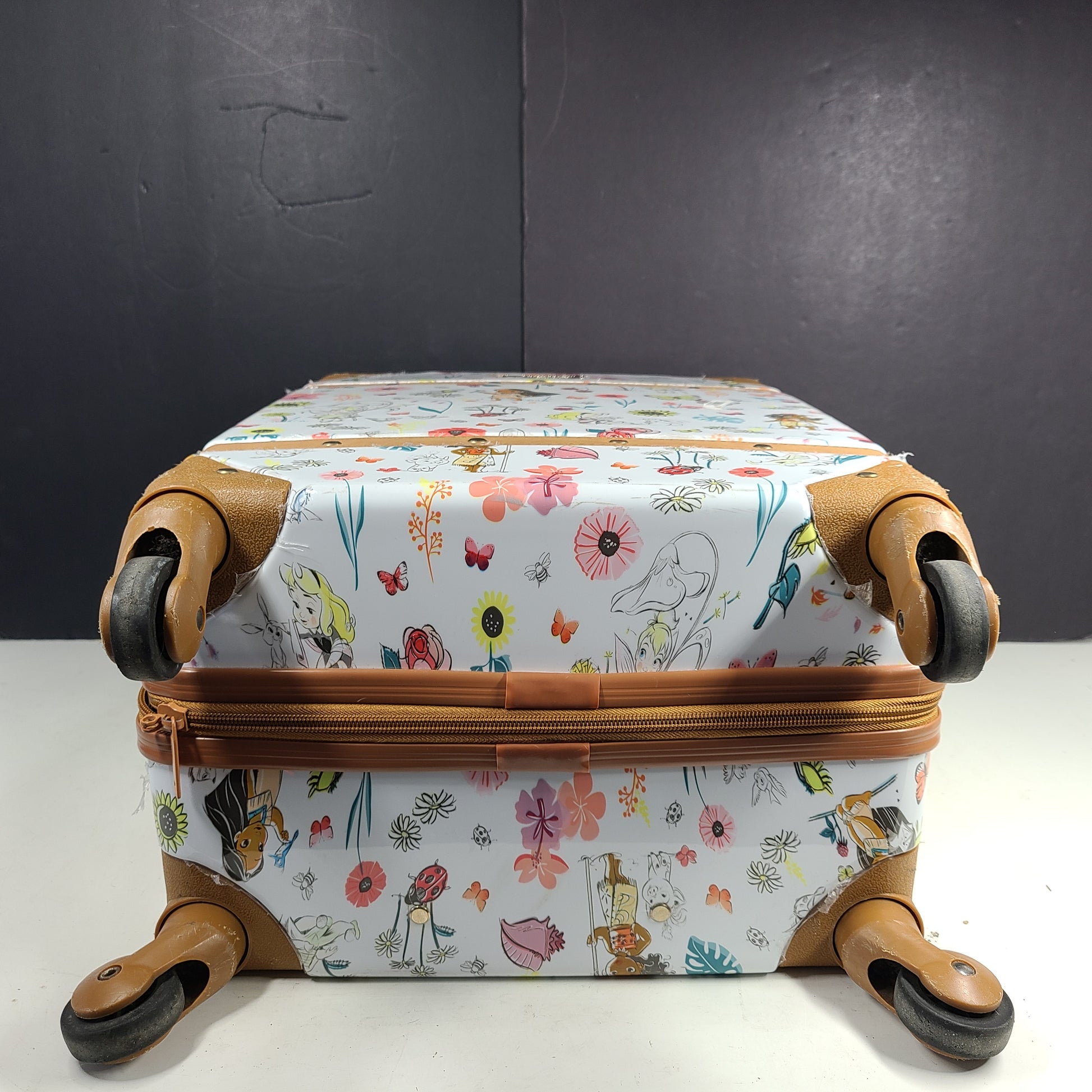 Multicolor faux-leather Disney Animators luggage in one size for stylish travel.