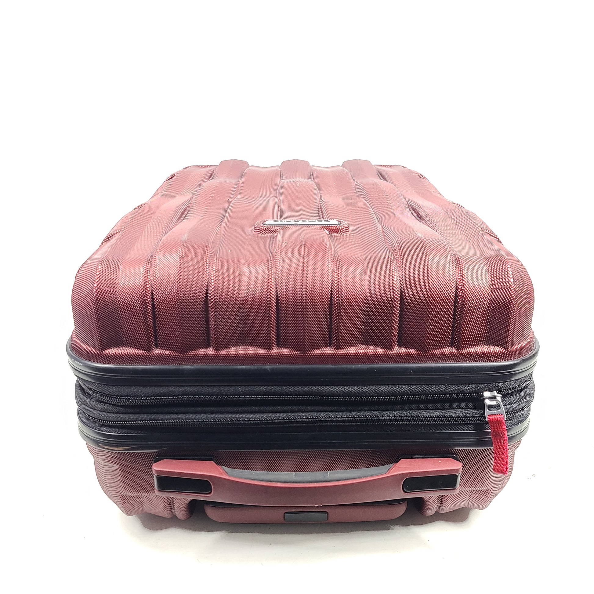 Red Samsonite spinner suitcase Model 7494 featuring a polyethylene vinyl acetate shell for travel durability.