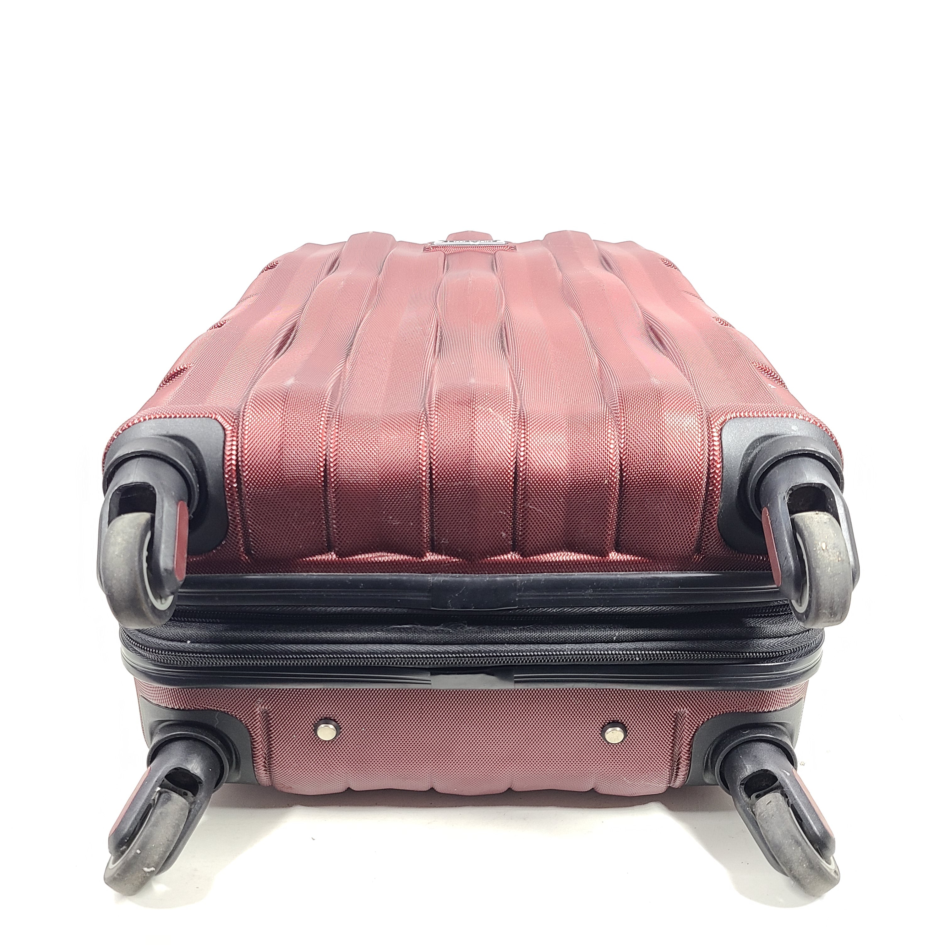 Red Samsonite spinner suitcase Model 7494 featuring a polyethylene vinyl acetate shell for travel durability.
