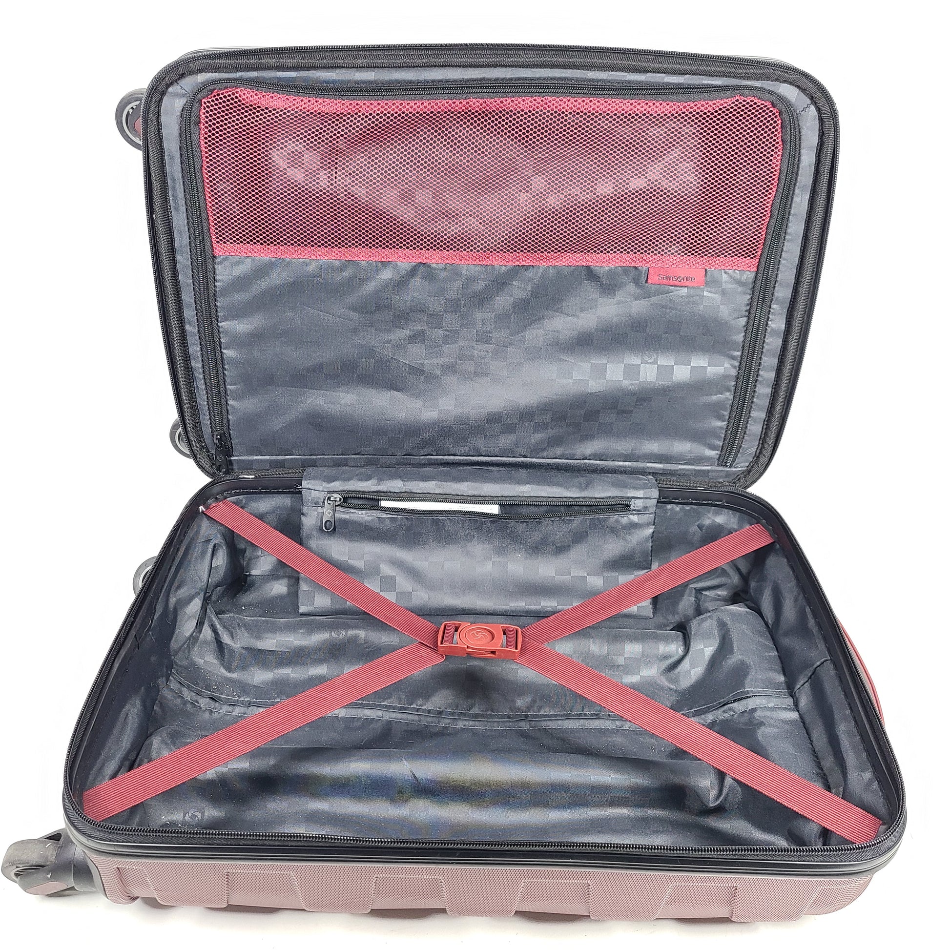 Red Samsonite spinner suitcase Model 7494 featuring a polyethylene vinyl acetate shell for travel durability.