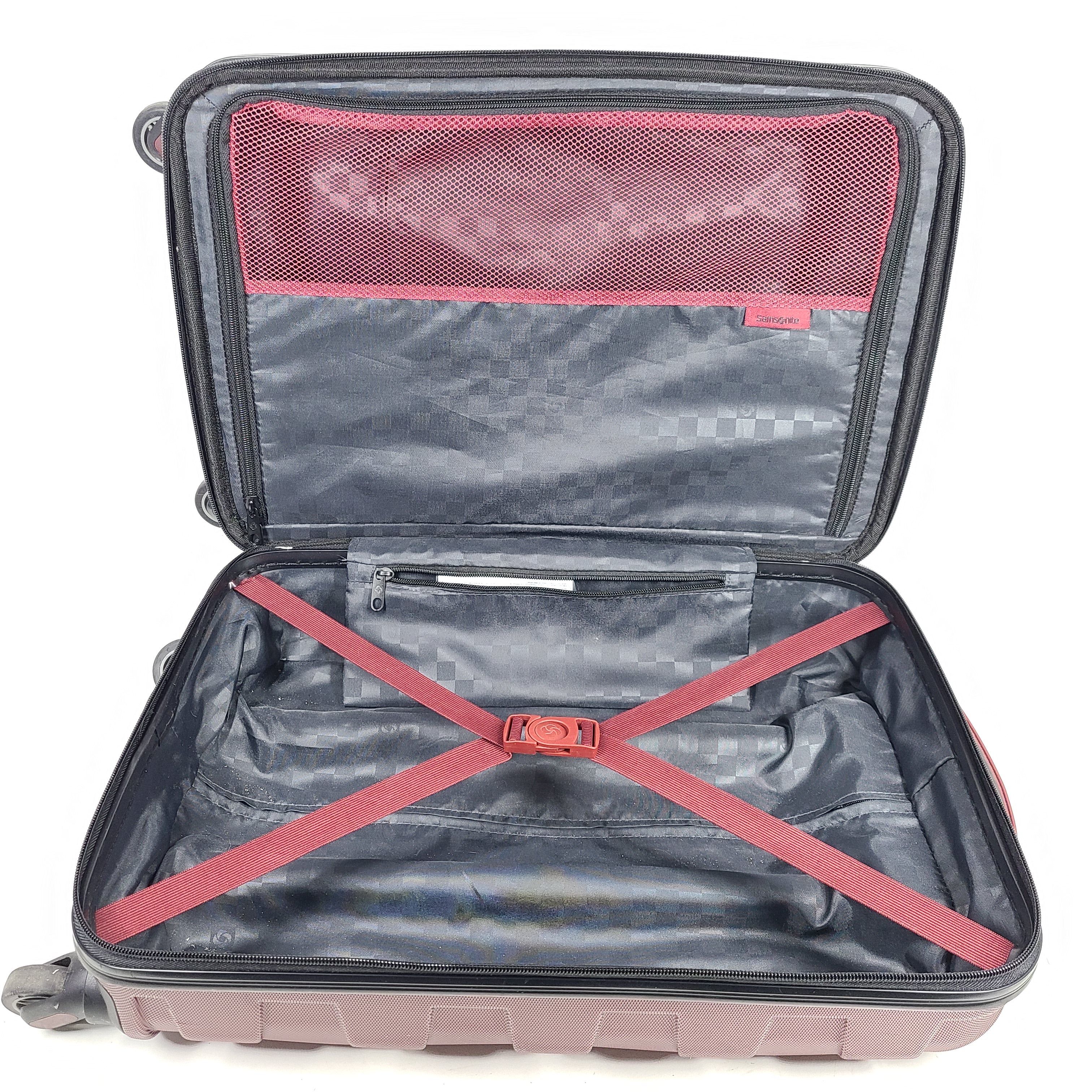Red Samsonite spinner suitcase Model 7494 featuring a polyethylene vinyl acetate shell for travel durability.