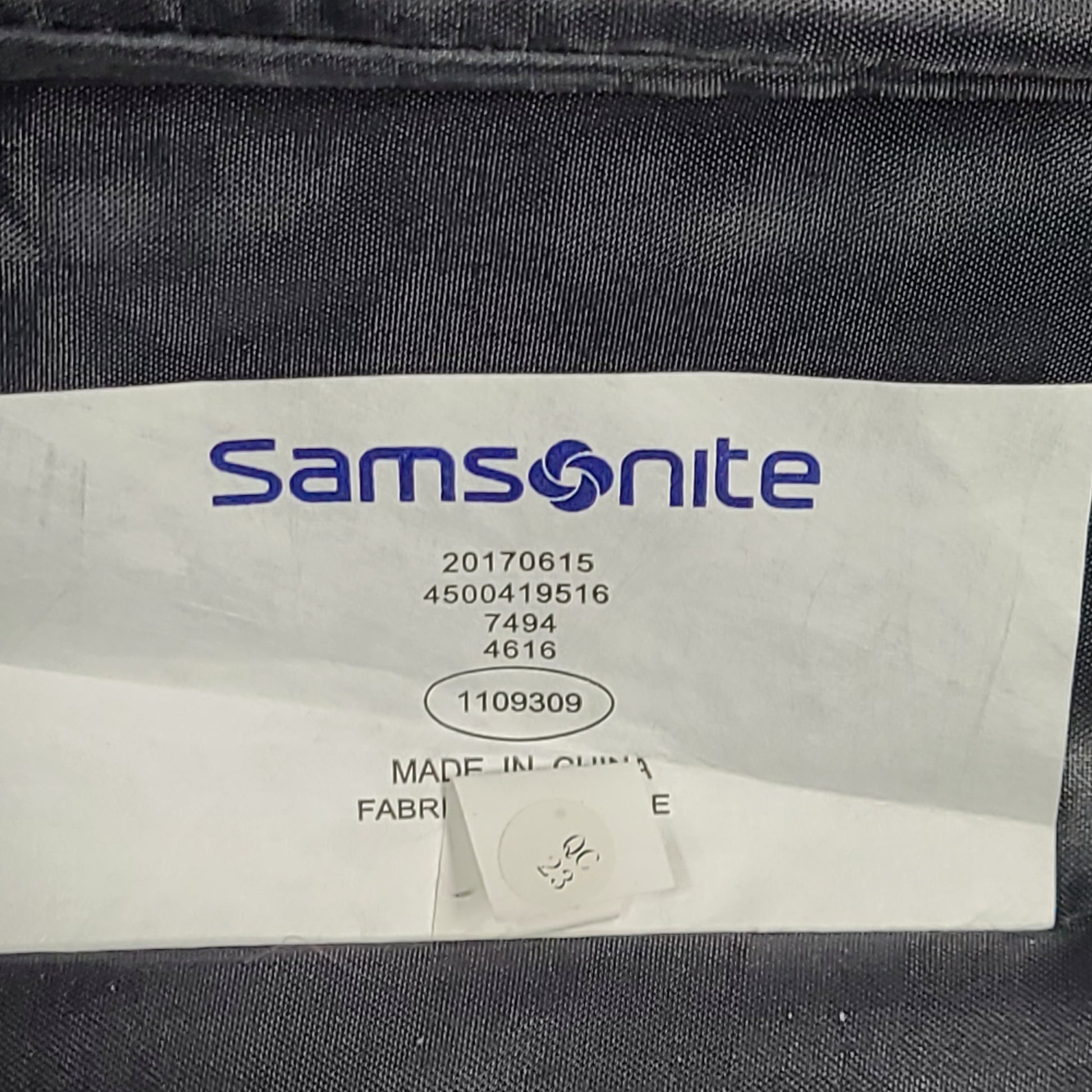Red Samsonite spinner suitcase Model 7494 featuring a polyethylene vinyl acetate shell for travel durability.