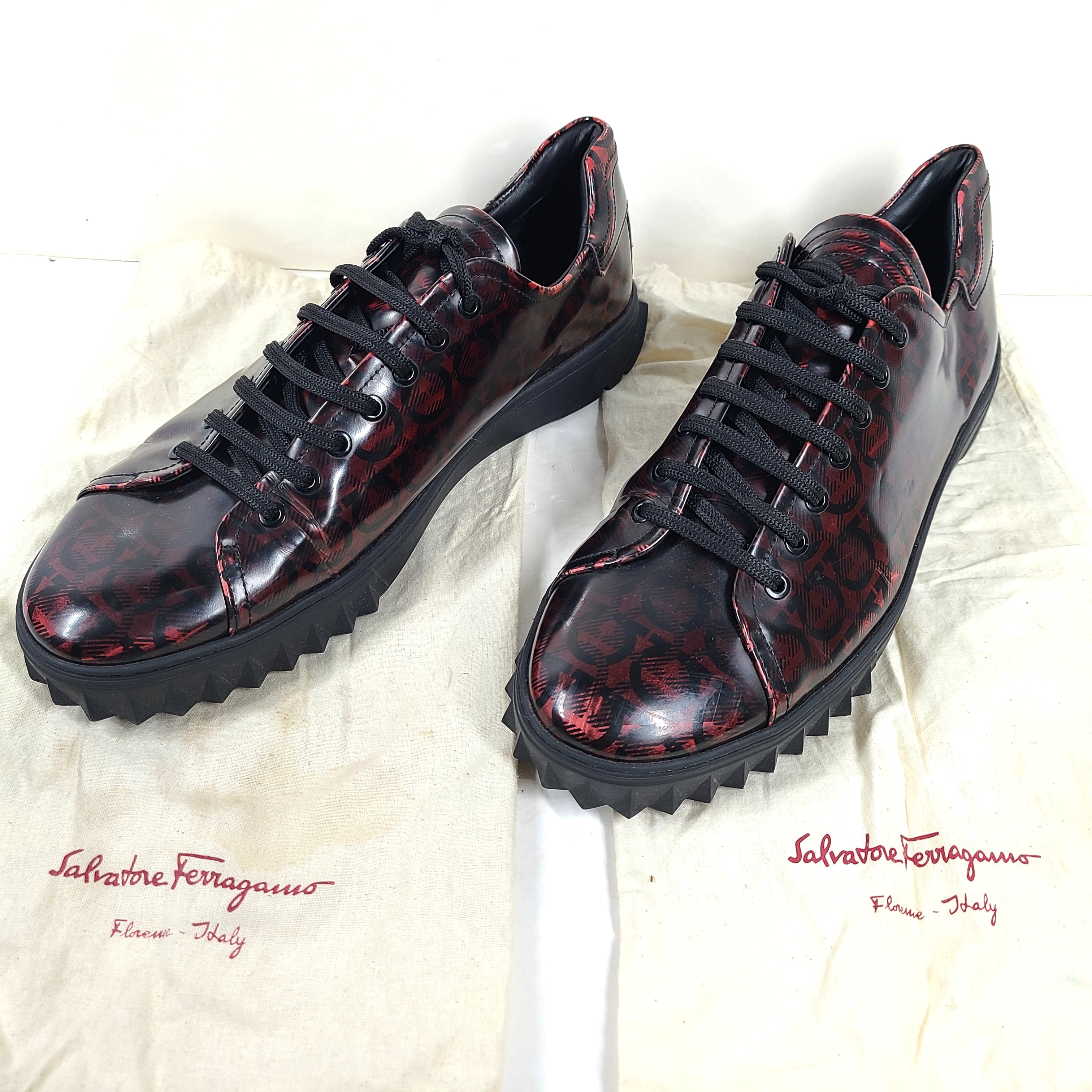 Red and black Salvatore Ferragamo TZ leather sneakers in size 11 1/2 M with Italian craftsmanship and contrast detailing.