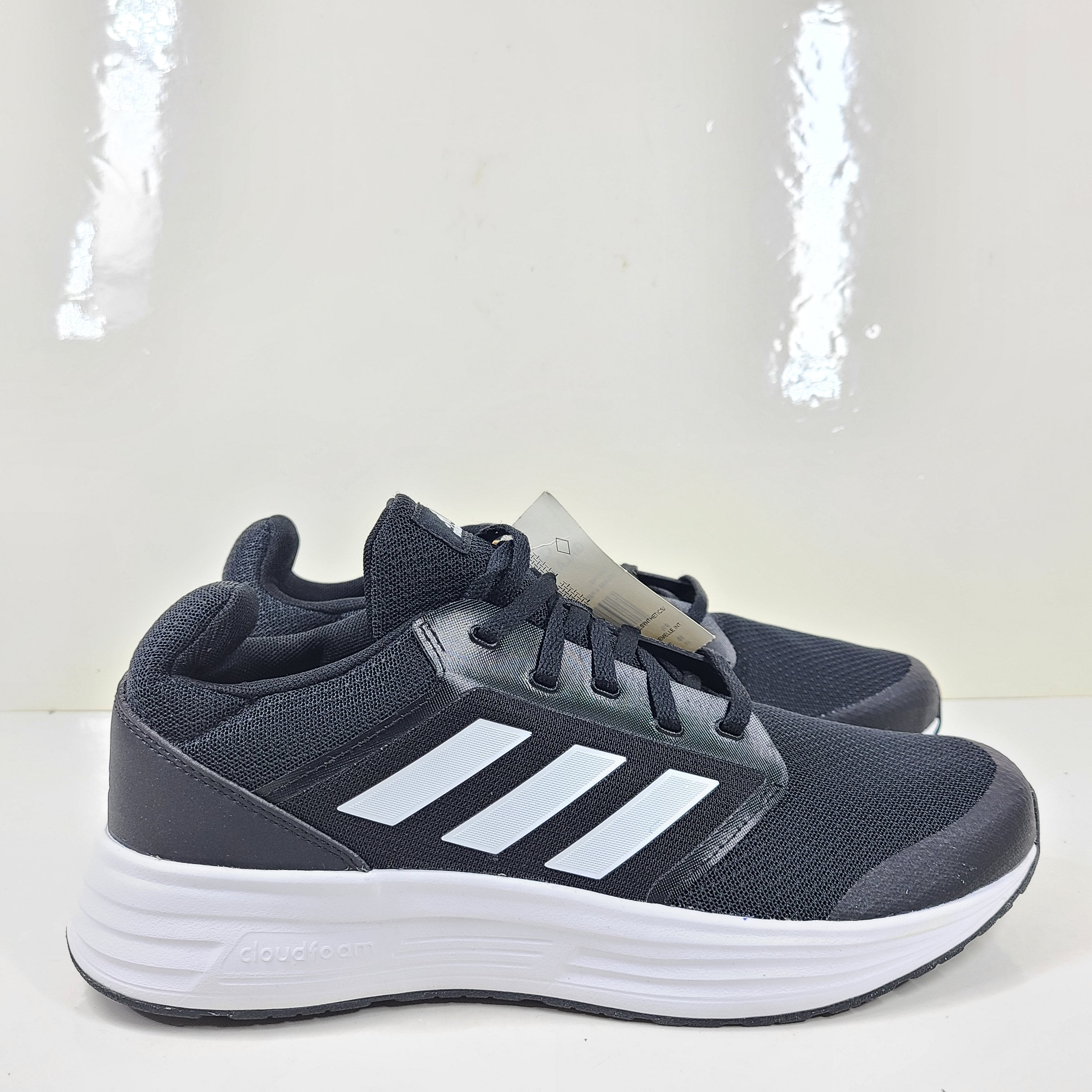 Adidas Galaxy 5 running shoe in black and white, US size 10, designed for everyday training and comfort.
