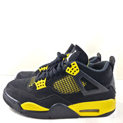 Black and yellow Air Jordan 4 Retro Thunder in US size 8 with a classic mid-top silhouette and durable rubber sole.