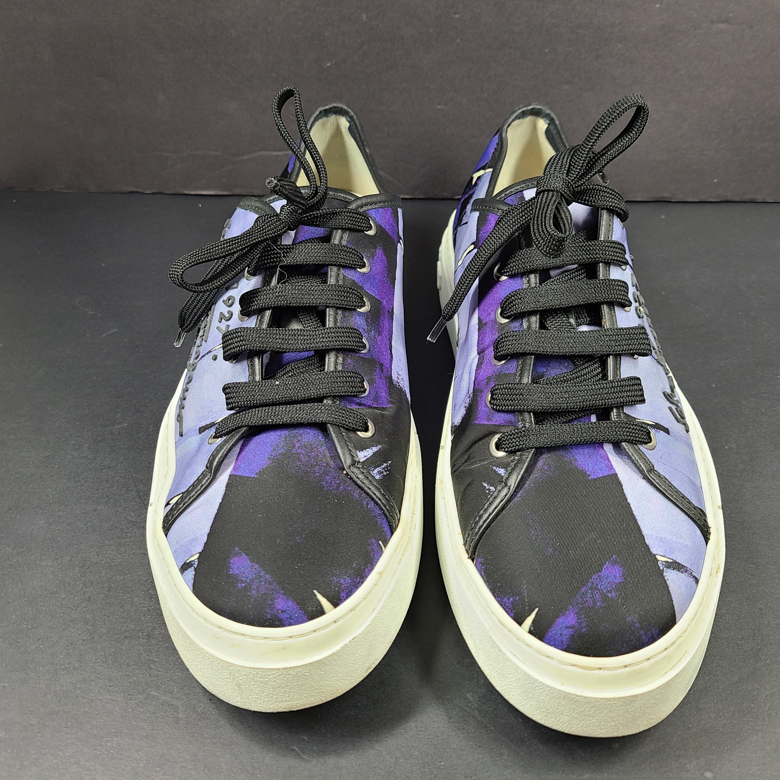 Salvatore Ferragamo multicolor men's sneakers in purple, black, and white with "Salvatore Ferragamo Firenze 1927" text on the side.
