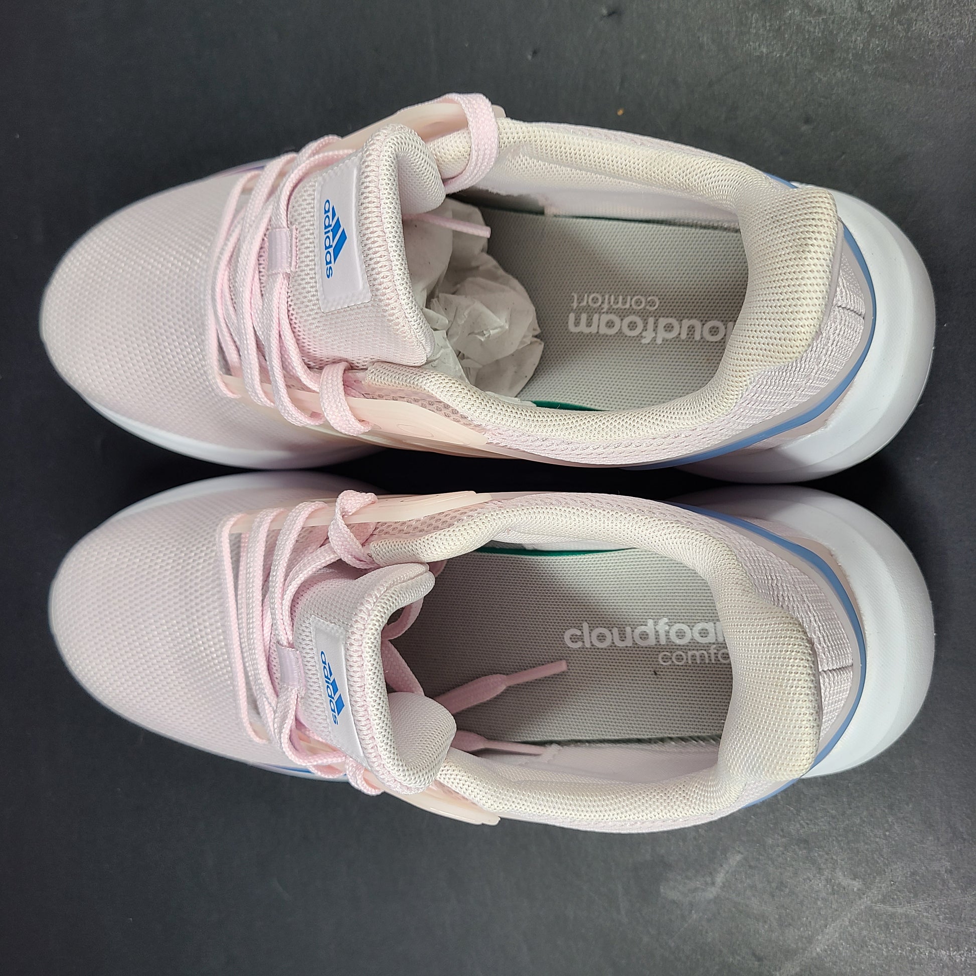 Lightweight pink Adidas running sneakers with Cloudfoam cushioning in US size 8.