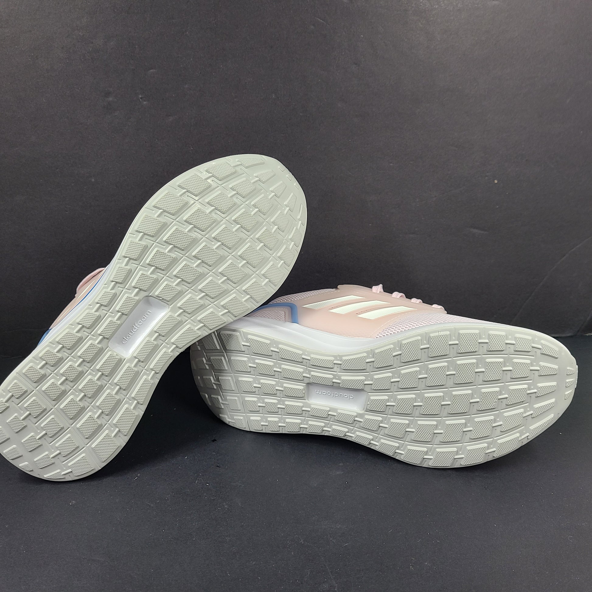 Lightweight pink Adidas running sneakers with Cloudfoam cushioning in US size 8.