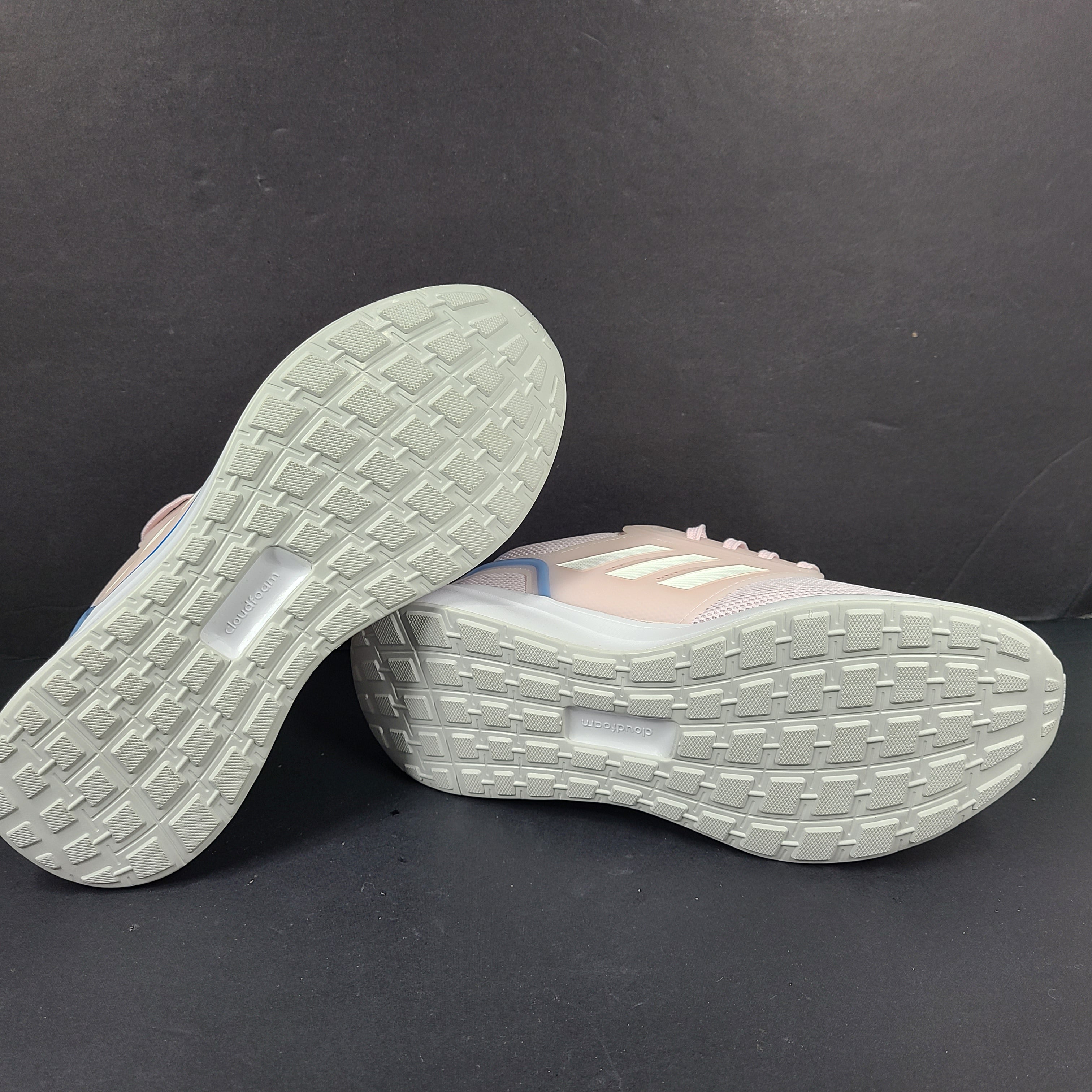 Lightweight pink Adidas running sneakers with Cloudfoam cushioning in US size 8.