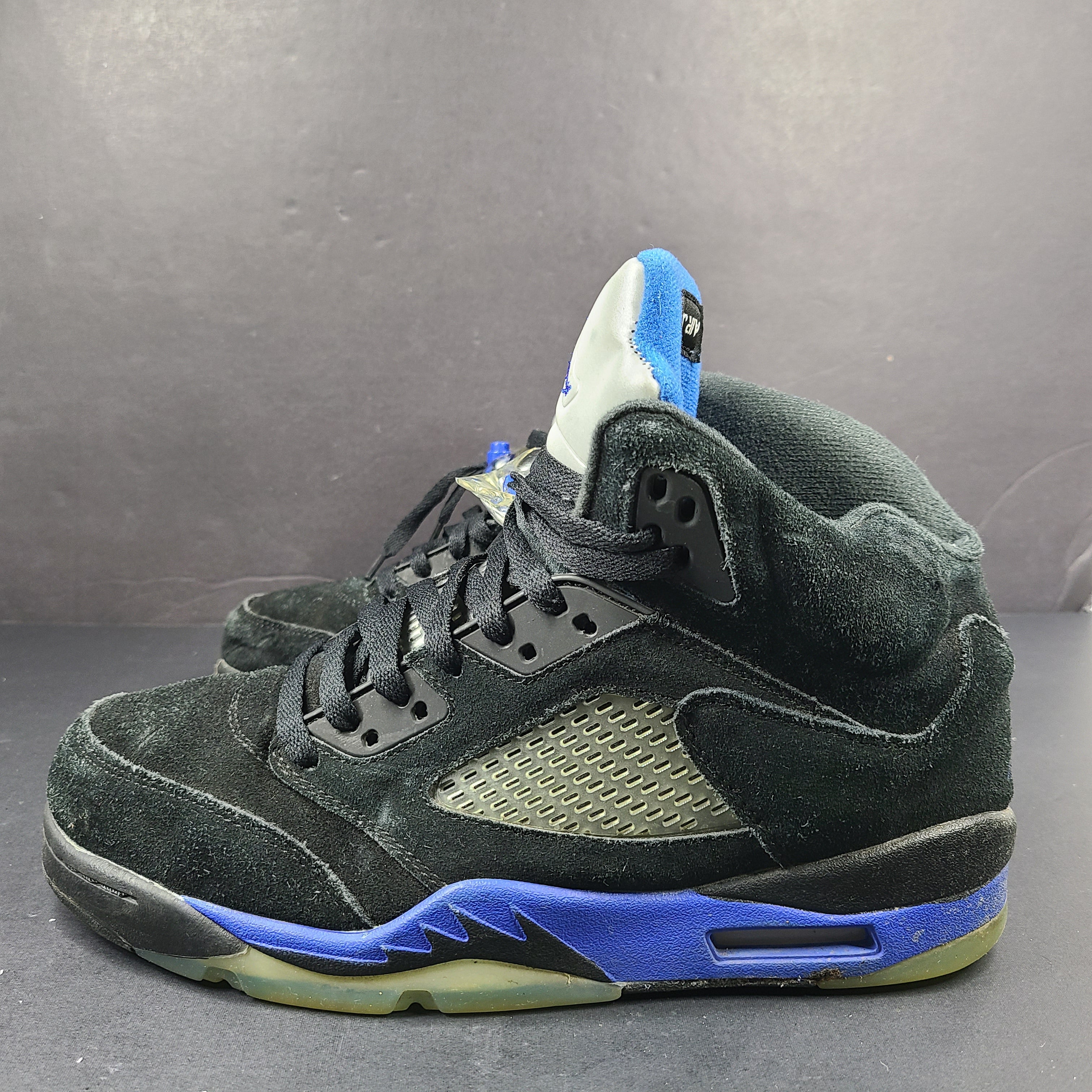 Nike Air Jordan 5 Retro Racer Blue sneakers in black and racer blue, UK 10 with Air Jordan branding on heel and tongue.