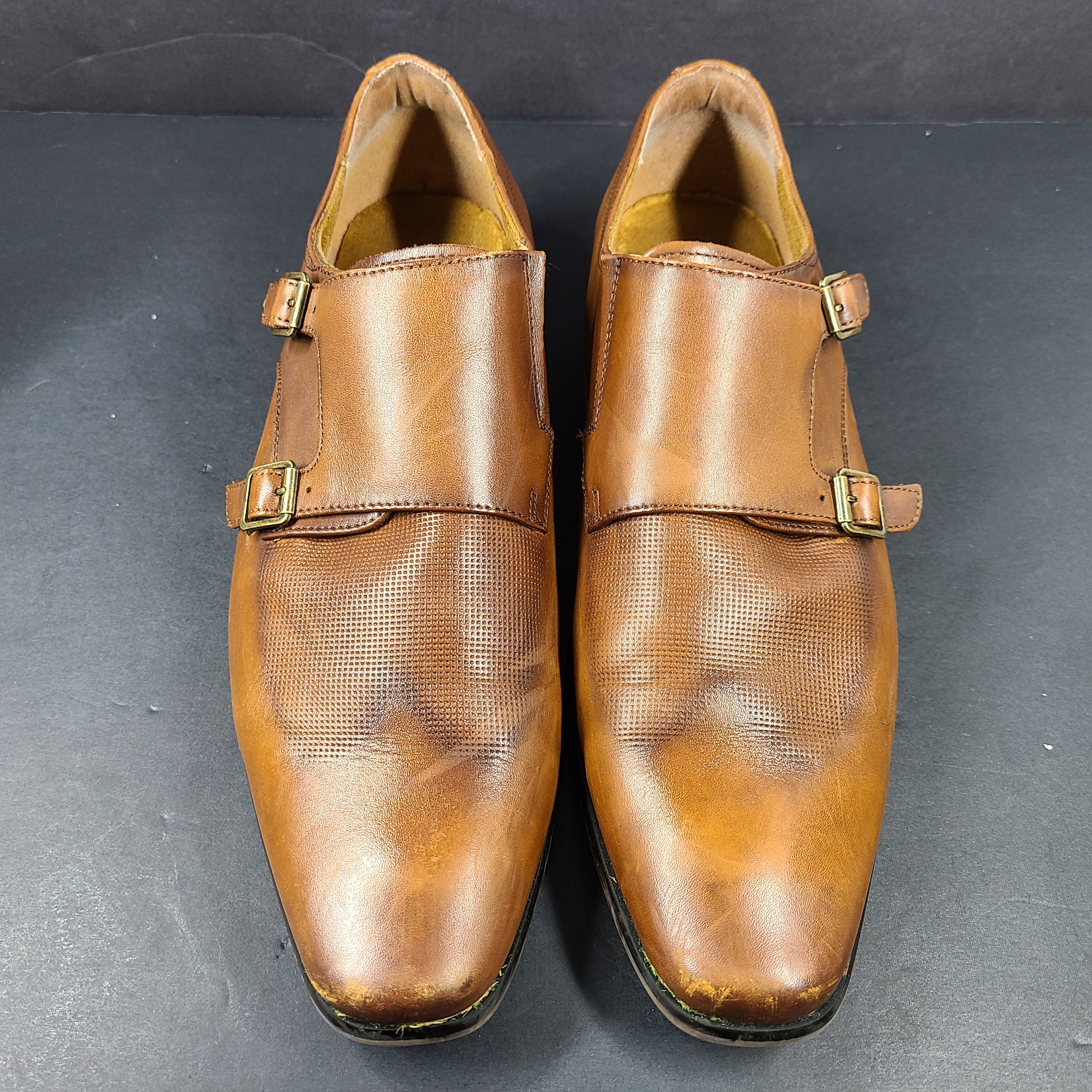 Brown Florsheim men's leather dress shoes size 9.5D with a leather upper and manmade balance materials.