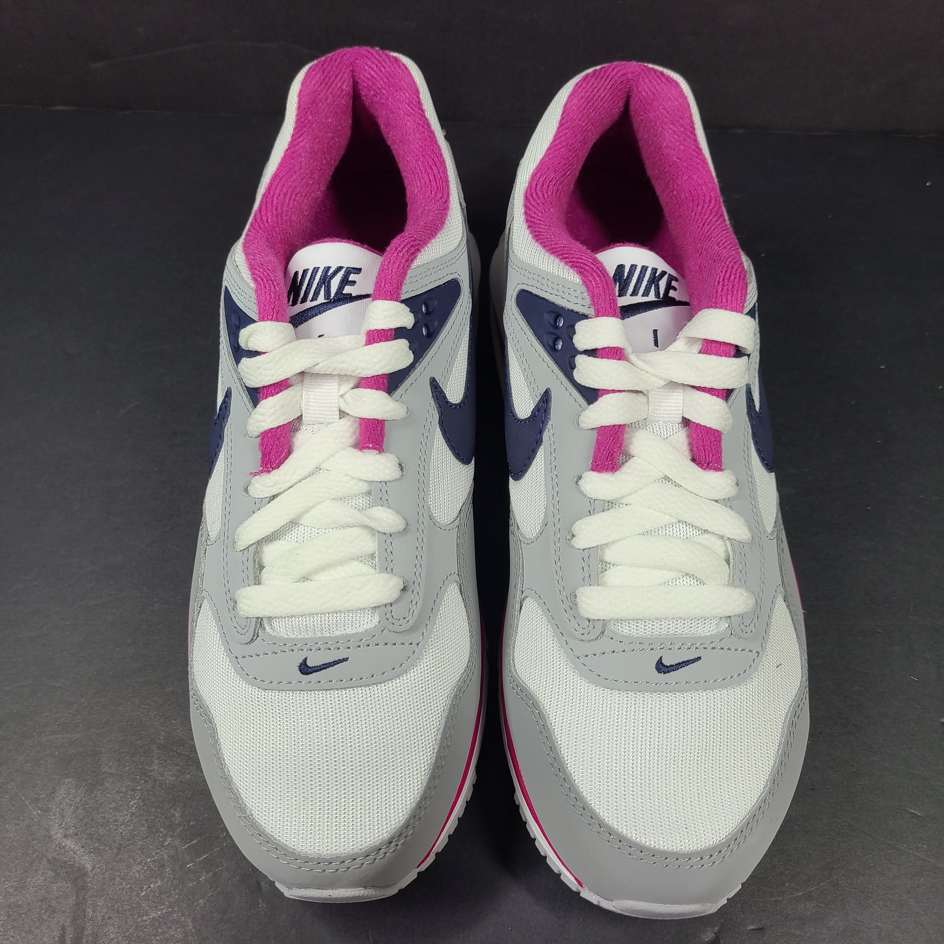 White, grey and pink Nike Air Max Correlate women's sneaker in US size 7.5 with Air Max cushioning.