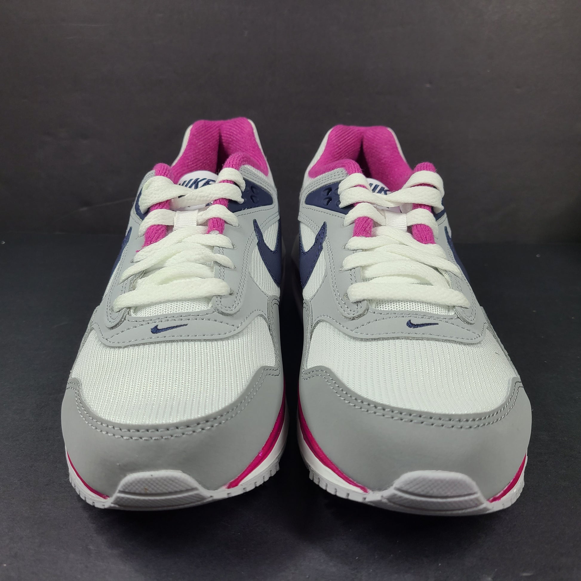 White, grey and pink Nike Air Max Correlate women's sneaker in US size 7.5 with Air Max cushioning.