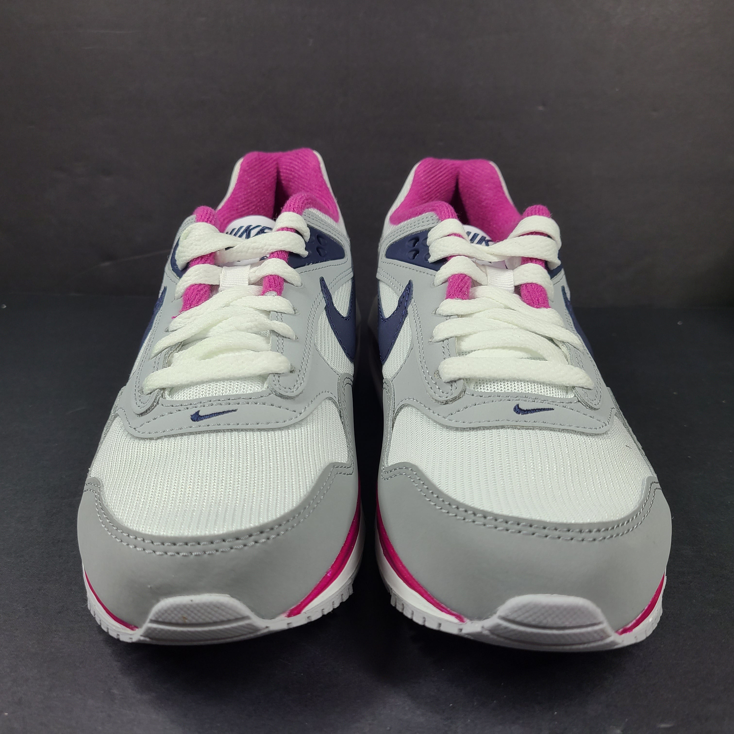 White, grey and pink Nike Air Max Correlate women's sneaker in US size 7.5 with Air Max cushioning.