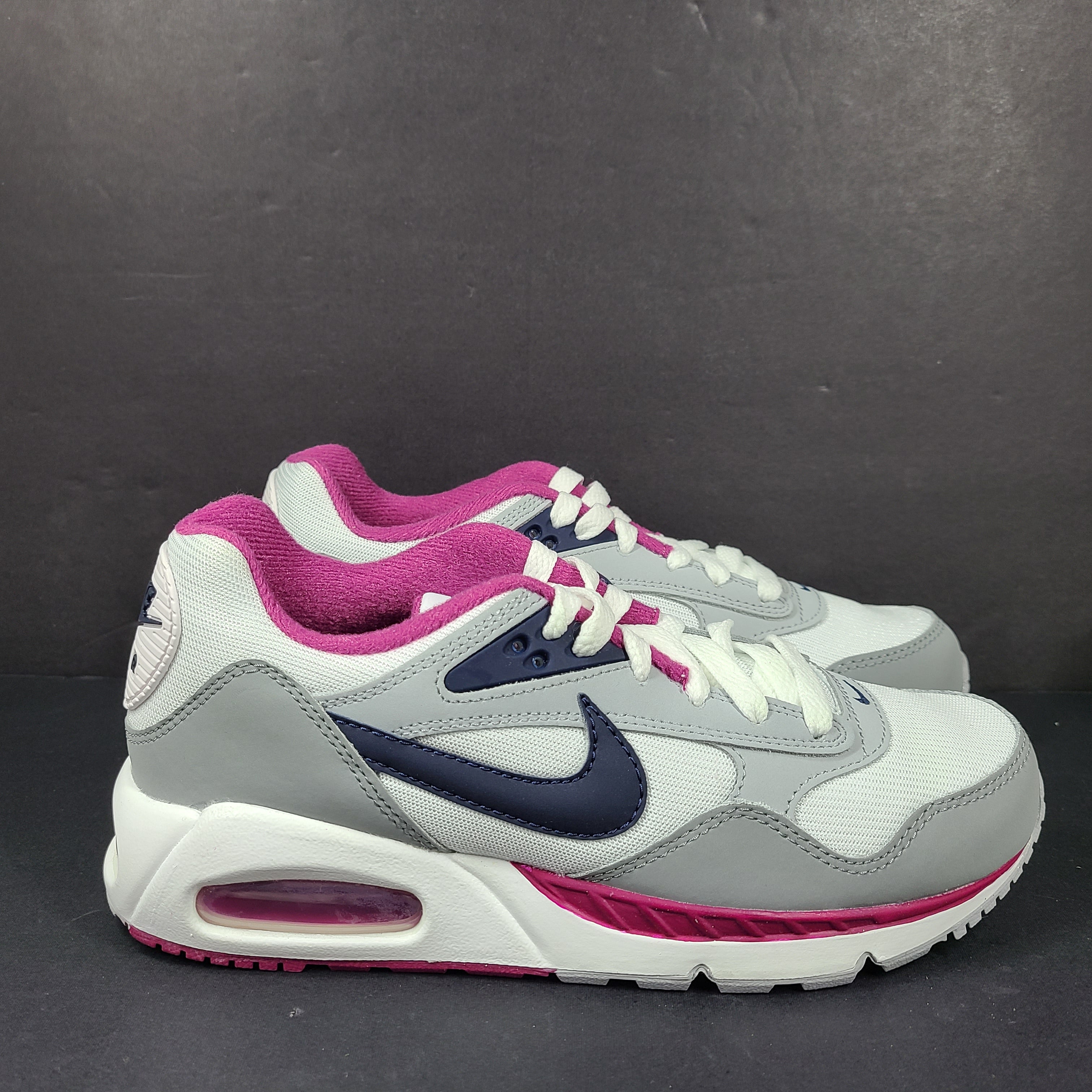 White, grey and pink Nike Air Max Correlate women's sneaker in US size 7.5 with Air Max cushioning.