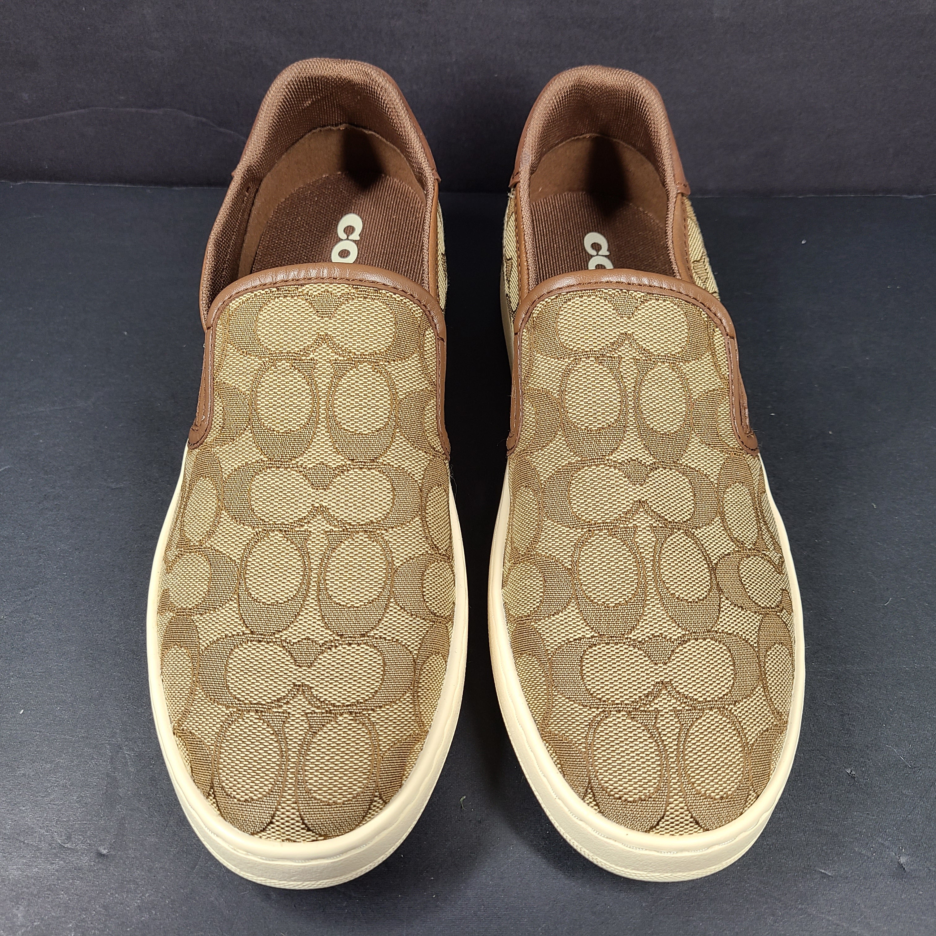 Coach slip-on sneakers model C4393 in brown, size 6.5B, designed for everyday wear.