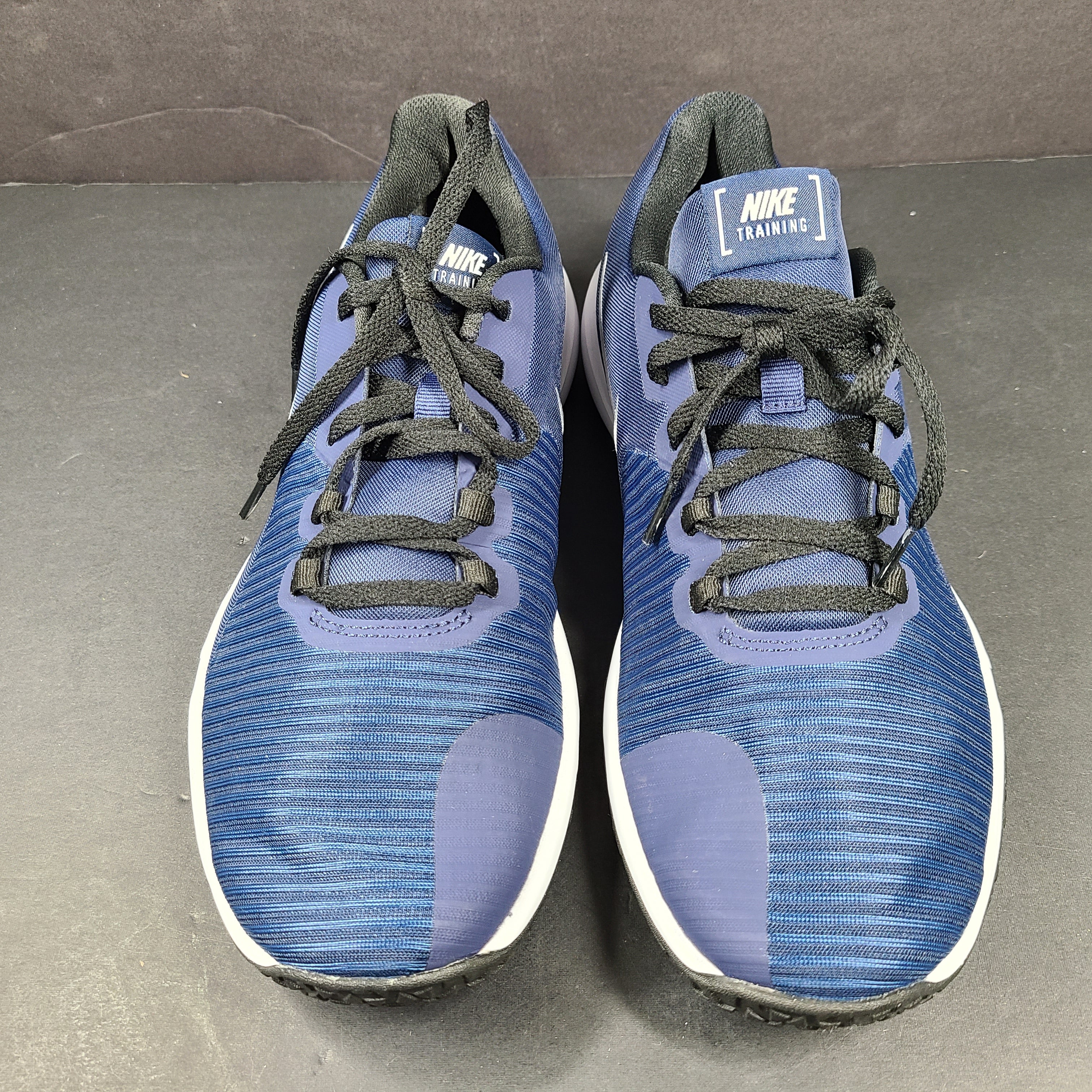 Men's Nike Flex Control 4 training shoe in blue, black, and white, US size 9, designed for stable, lightweight workouts.