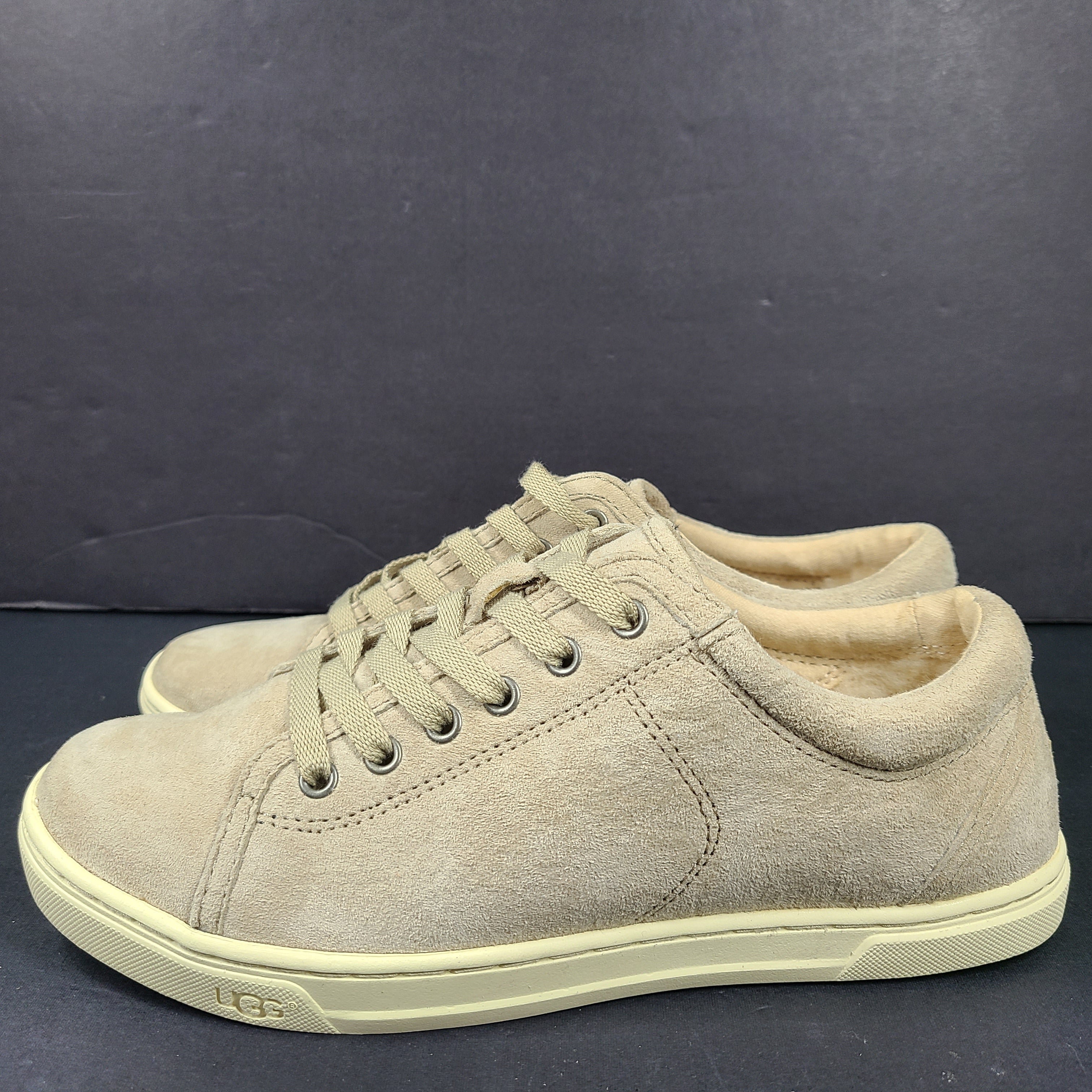 Beige UGG Tomi suede low-top sneakers in US size 7.5 designed for casual comfort.