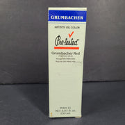 Three artist-grade oil paint colors in cobalt blue, burnt sienna, and red for studio painting.