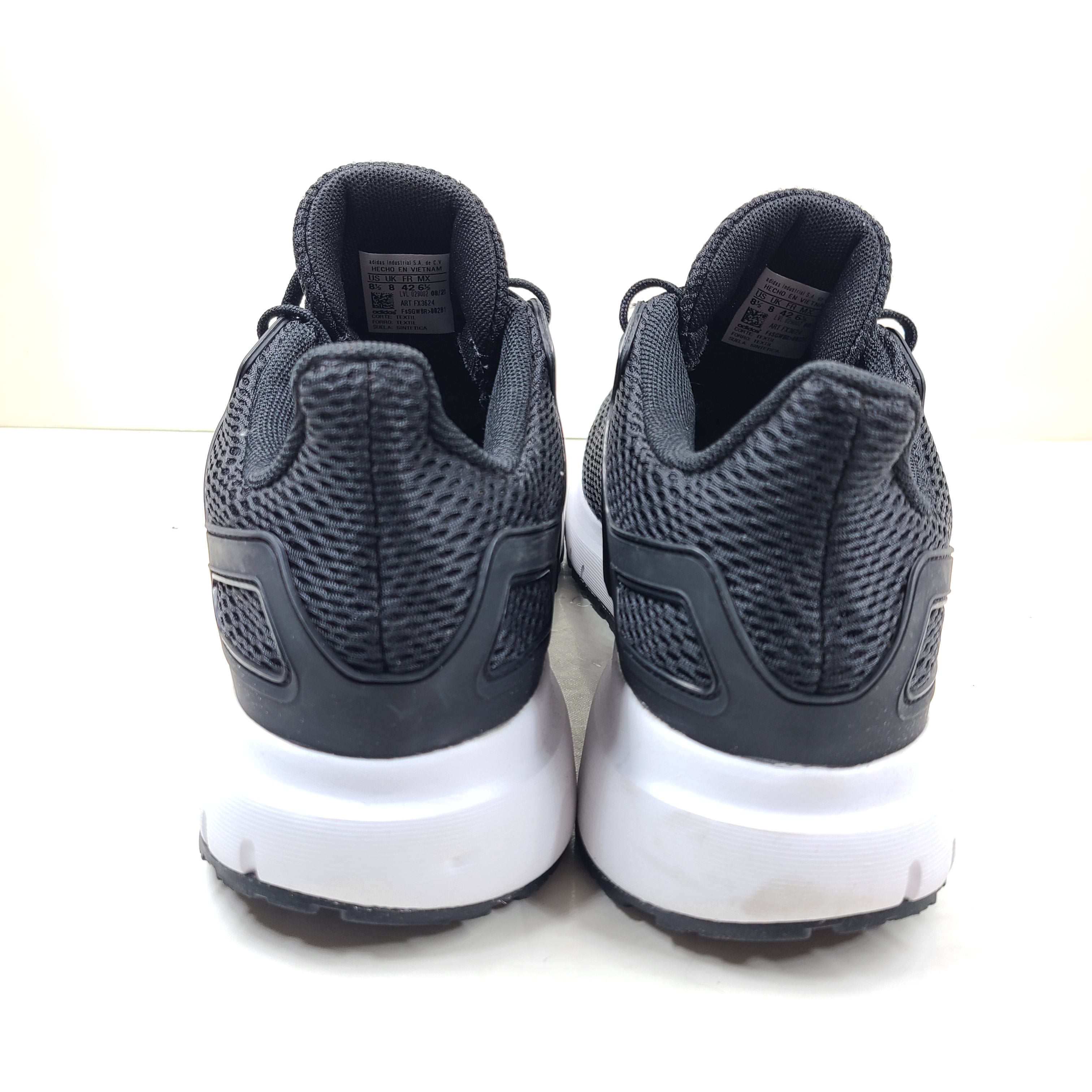 Black Adidas Ultimashow running shoes in US 8.5 with a supportive, low-profile design and durable outsole.