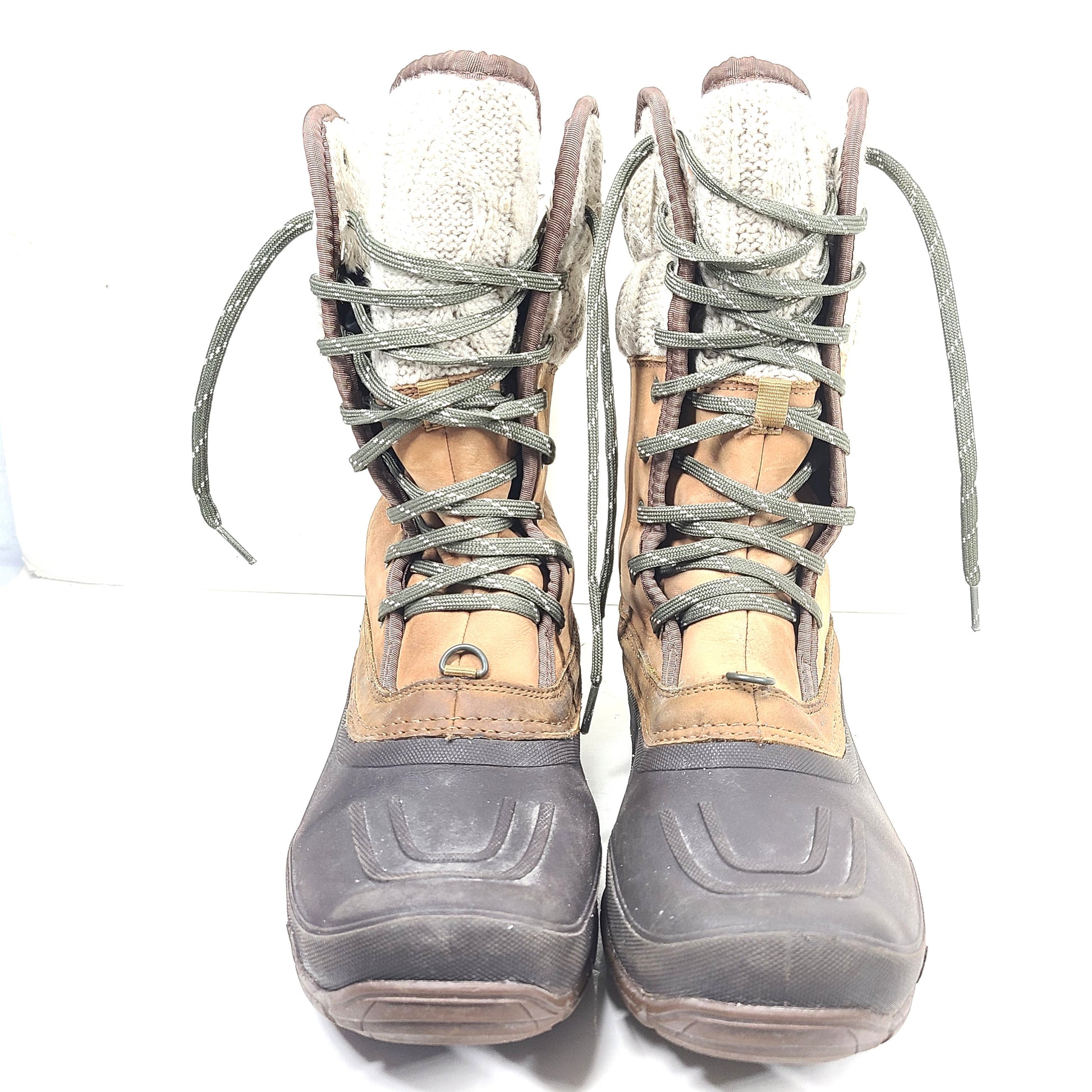 Sturdy brown and gray women's boots with faux fur lining and durable soles for outdoor use.