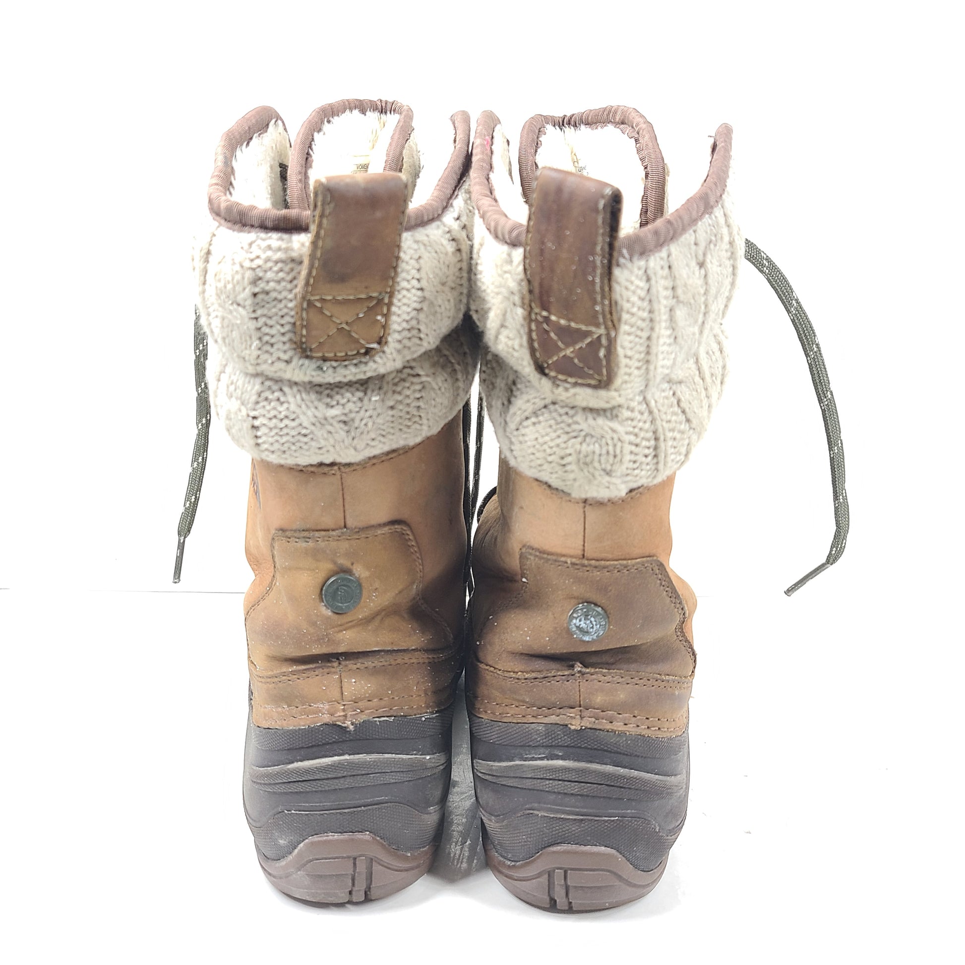 Sturdy brown and gray women's boots with faux fur lining and durable soles for outdoor use.