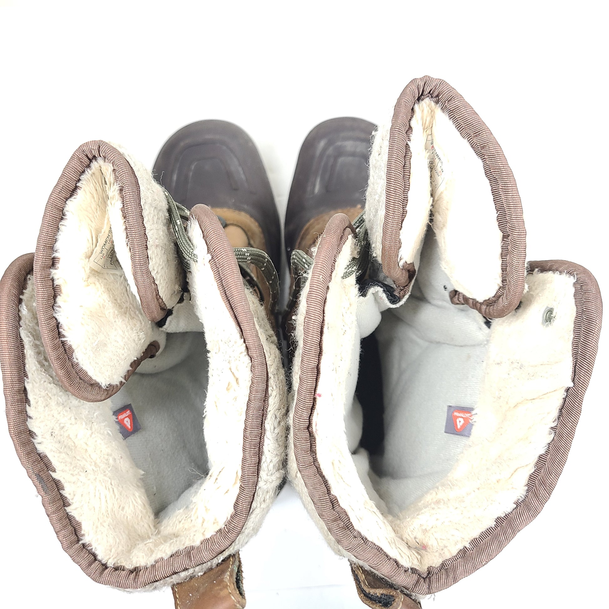 Sturdy brown and gray women's boots with faux fur lining and durable soles for outdoor use.