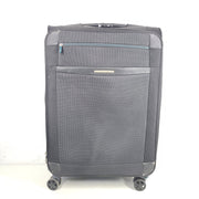 Black Samsonite 67/24 EXP spinner suitcase with scuffs and marks on the exterior.