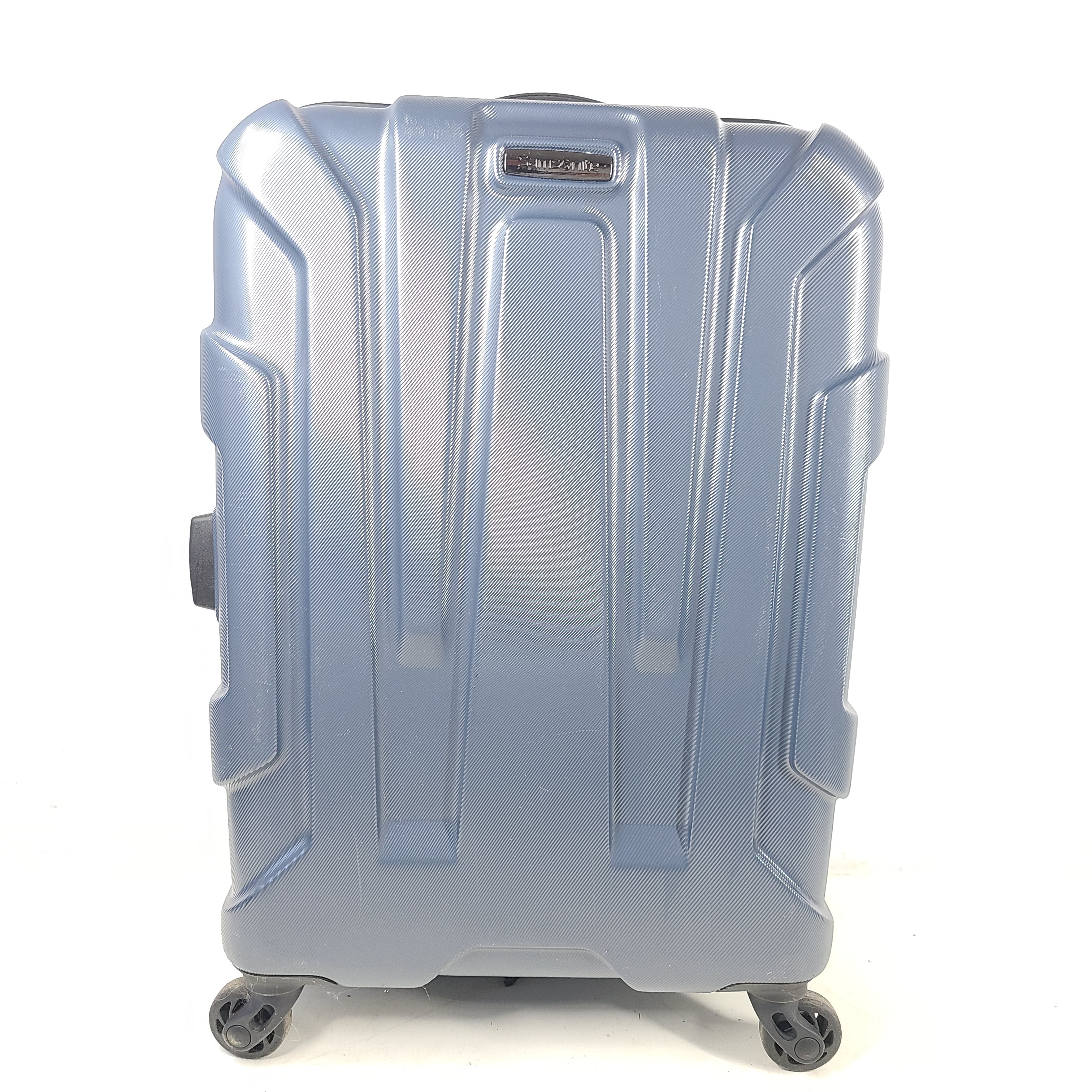 Blue Samsonite 8853 hard-shell spinner suitcase with exterior scuffs and a clean interior.