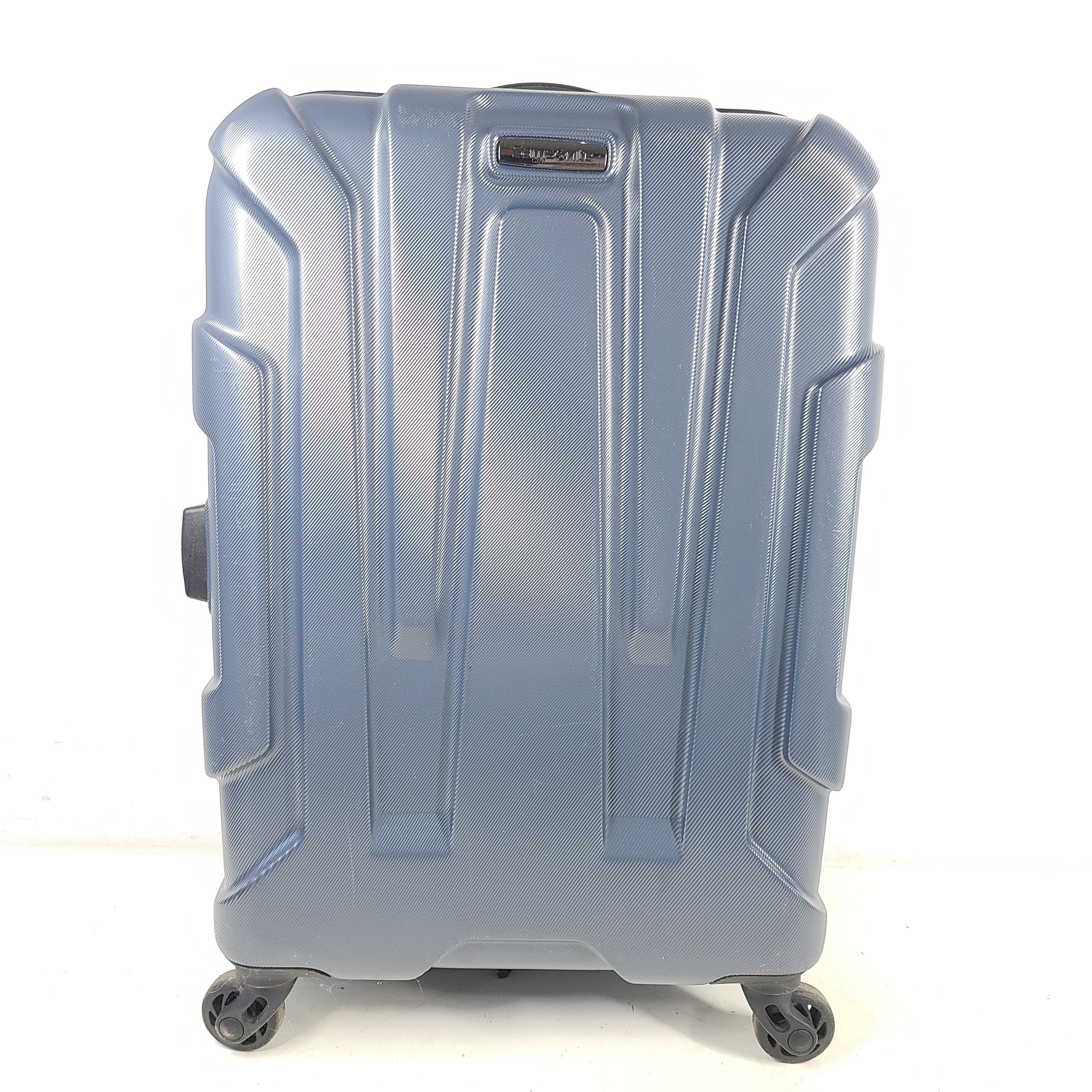 Blue Samsonite 8853 hard-shell spinner suitcase with exterior scuffs and a clean interior.