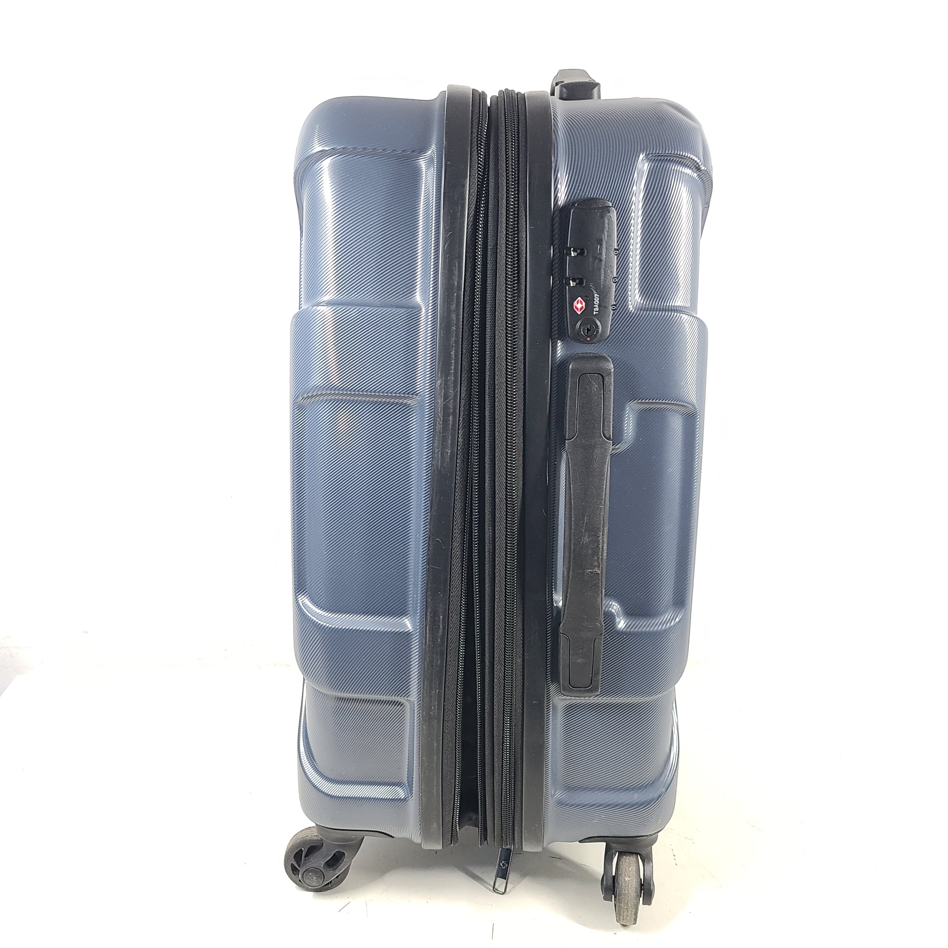 Blue Samsonite 8853 hard-shell spinner suitcase with exterior scuffs and a clean interior.