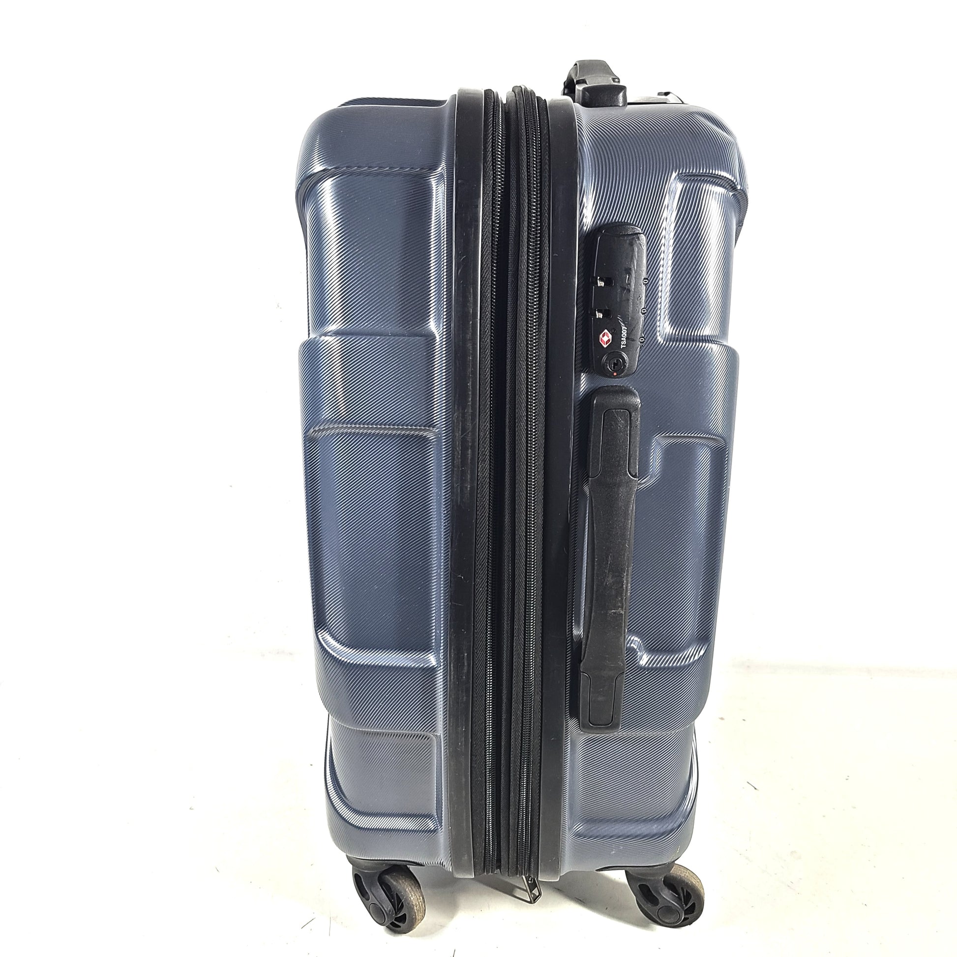 Blue Samsonite 8853 hard-shell spinner suitcase with exterior scuffs and a clean interior.