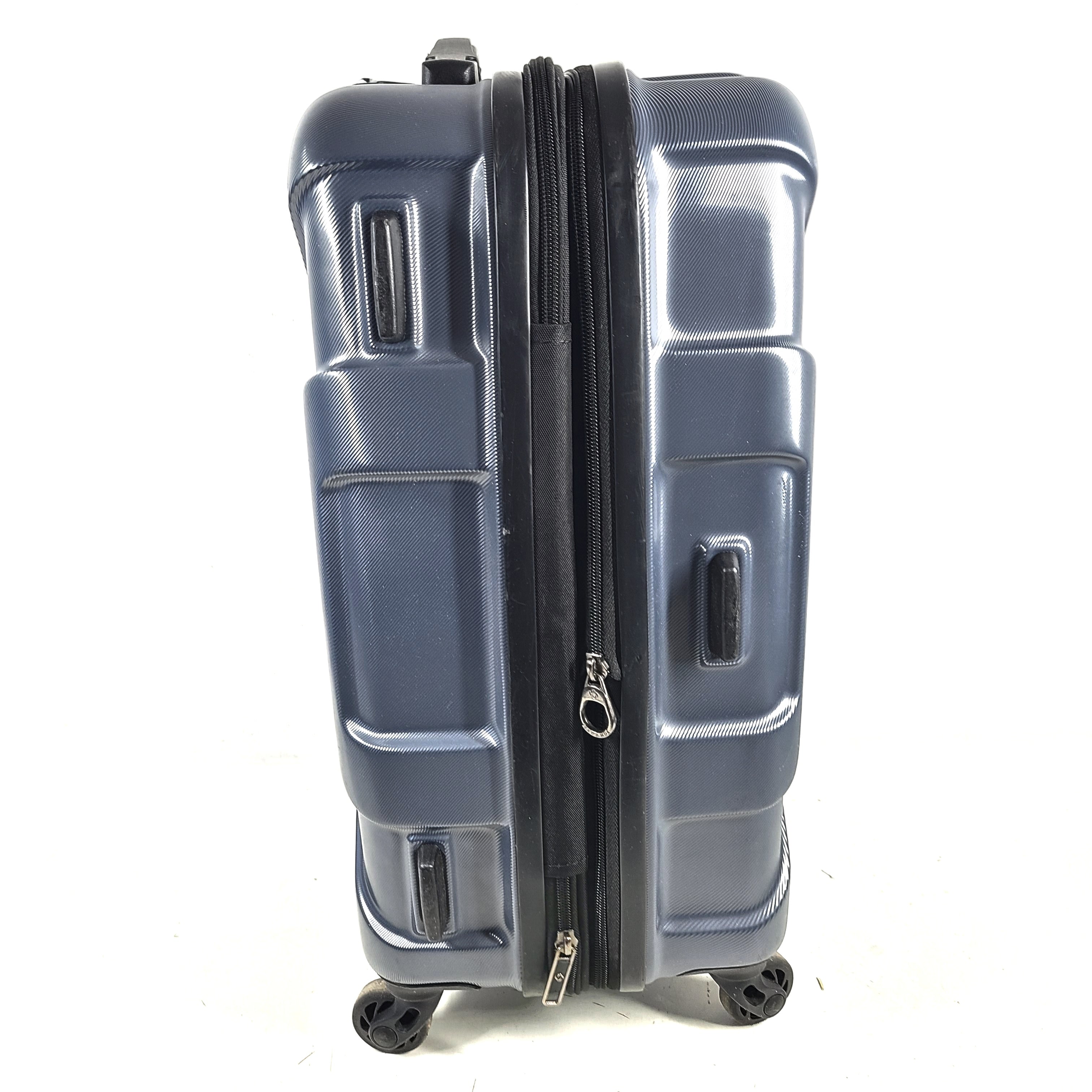 Blue Samsonite 8853 hard-shell spinner suitcase with exterior scuffs and a clean interior.
