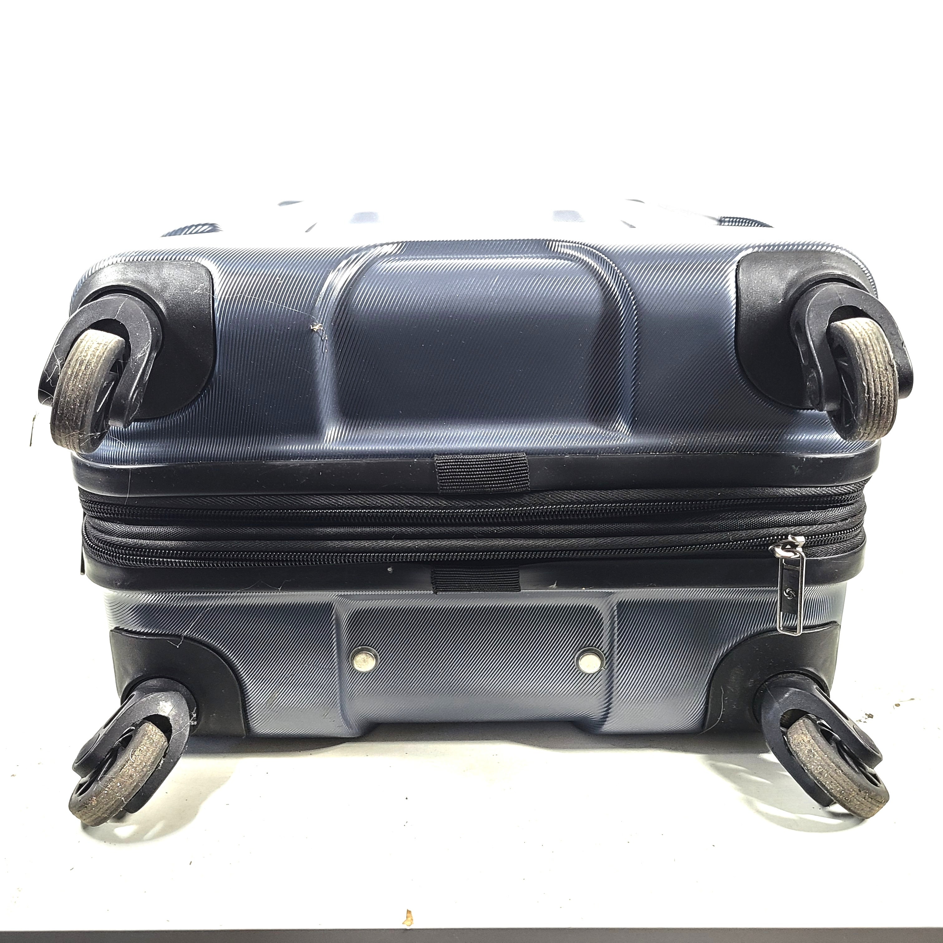Blue Samsonite 8853 hard-shell spinner suitcase with exterior scuffs and a clean interior.