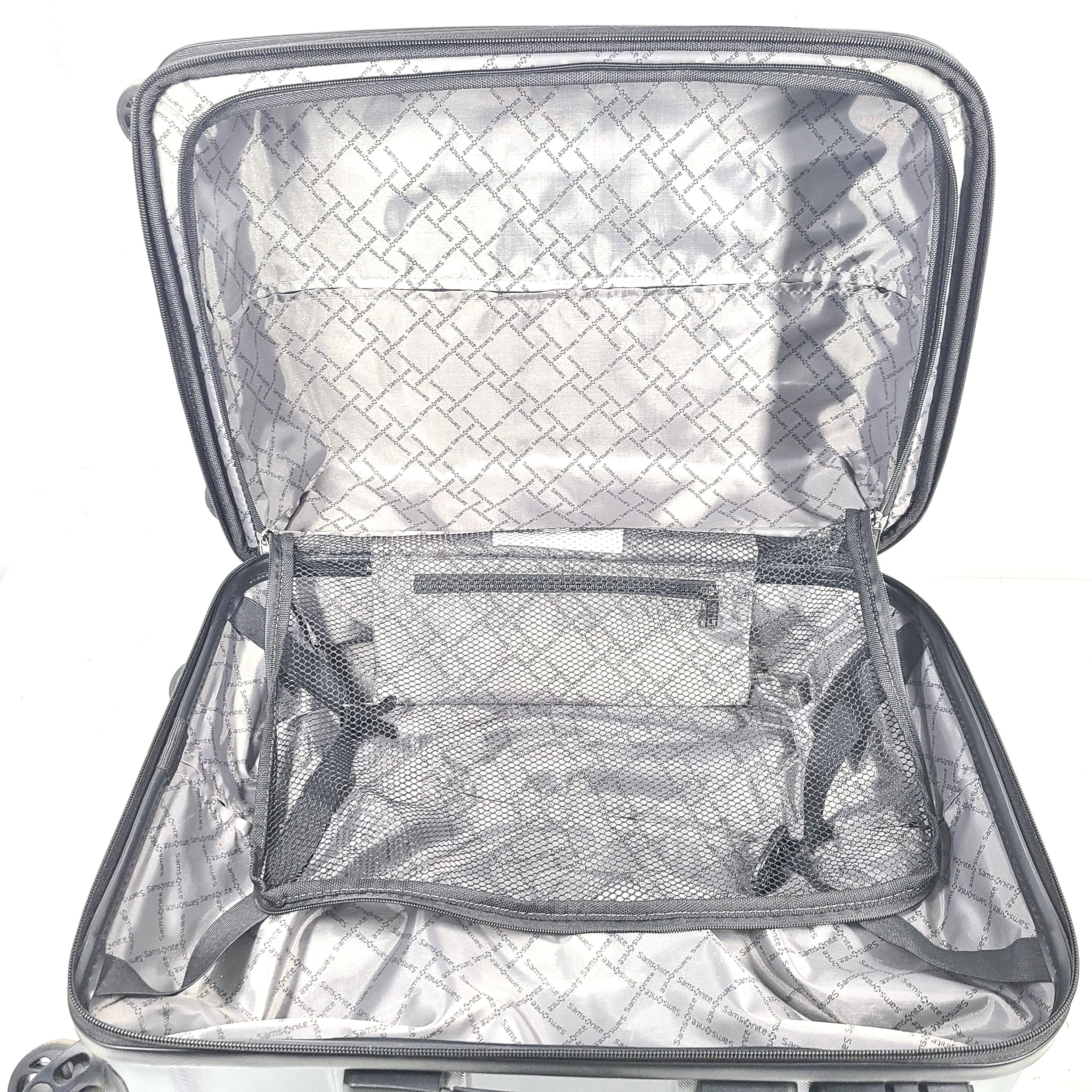 Blue Samsonite 8853 hard-shell spinner suitcase with exterior scuffs and a clean interior.