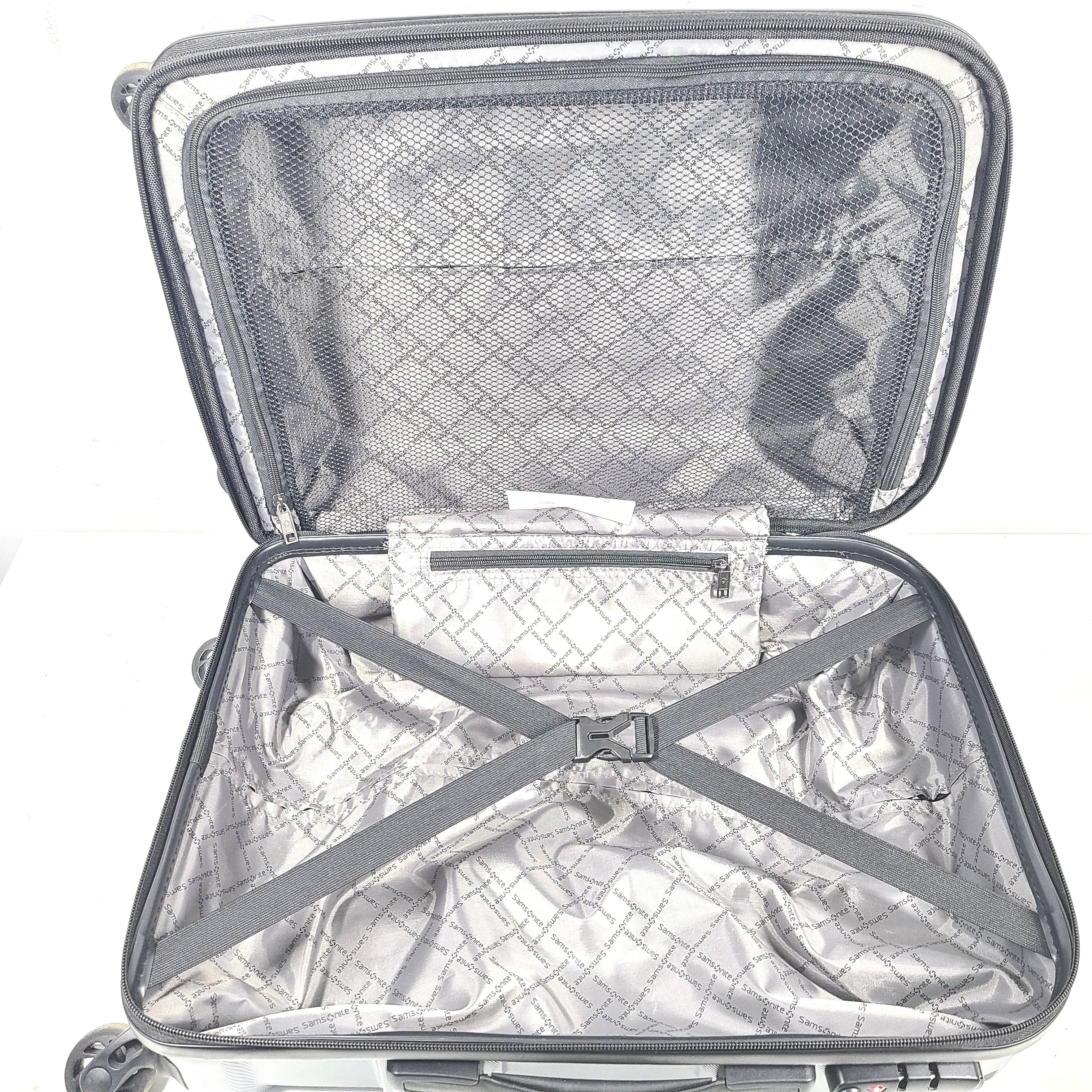Blue Samsonite 8853 hard-shell spinner suitcase with exterior scuffs and a clean interior.