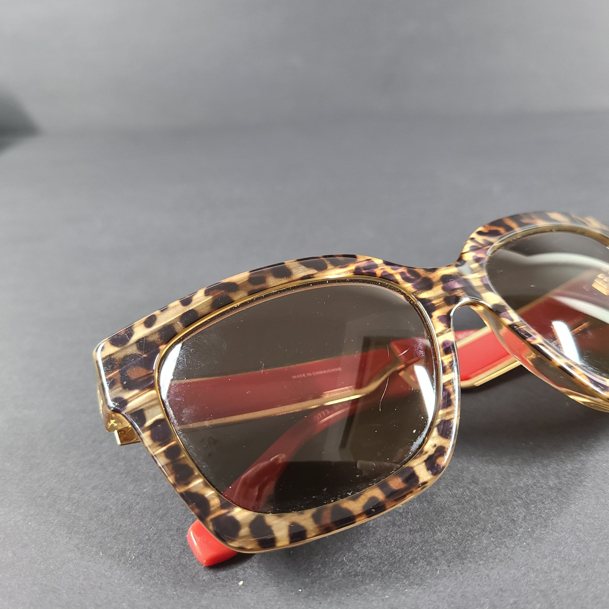 Michael Kors Berkshires MK-2102 leopard and red square sunglasses with logo-accent temples.