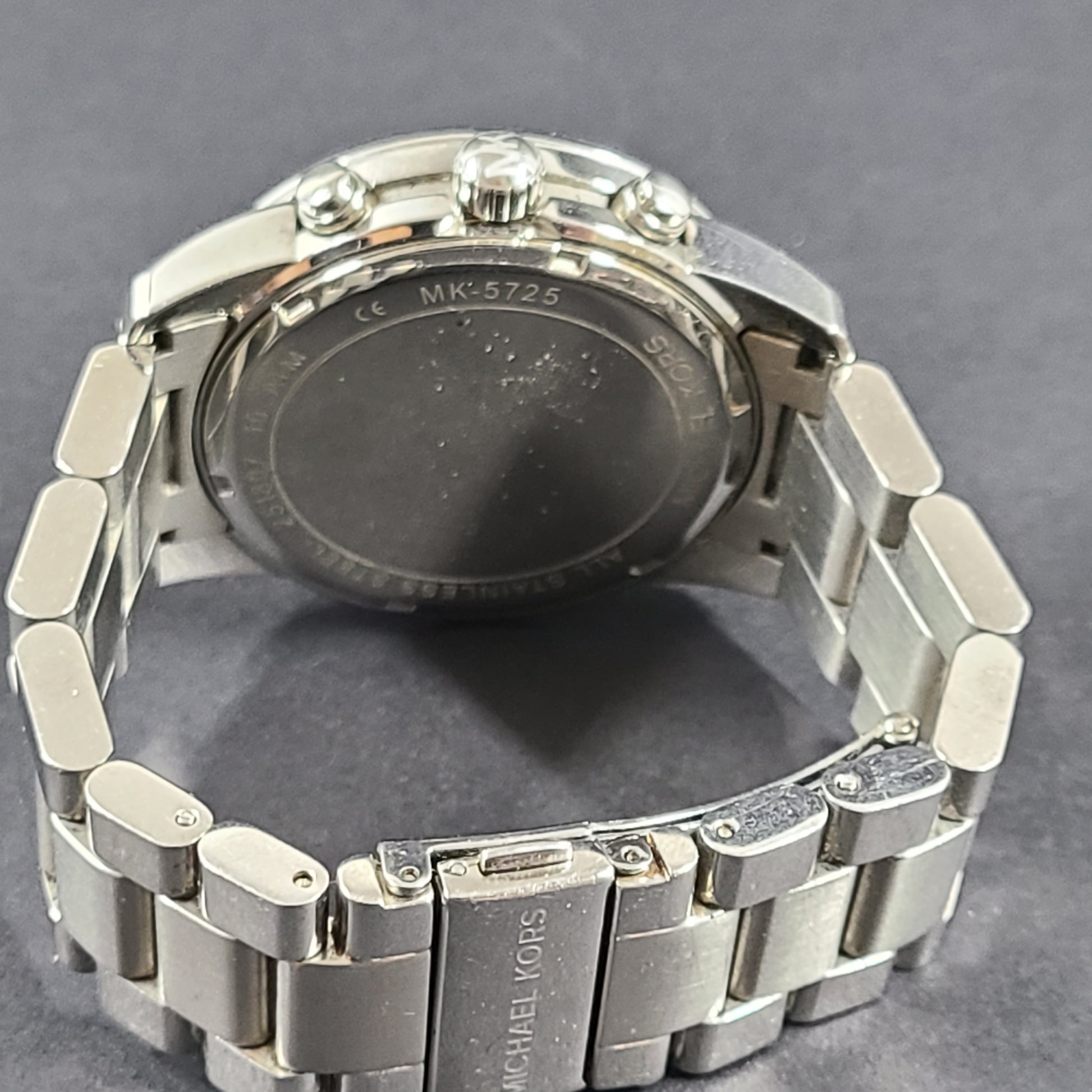Michael Kors Mercer MK-5725 stainless steel chronograph wristwatch with a silver dial and 42mm case.