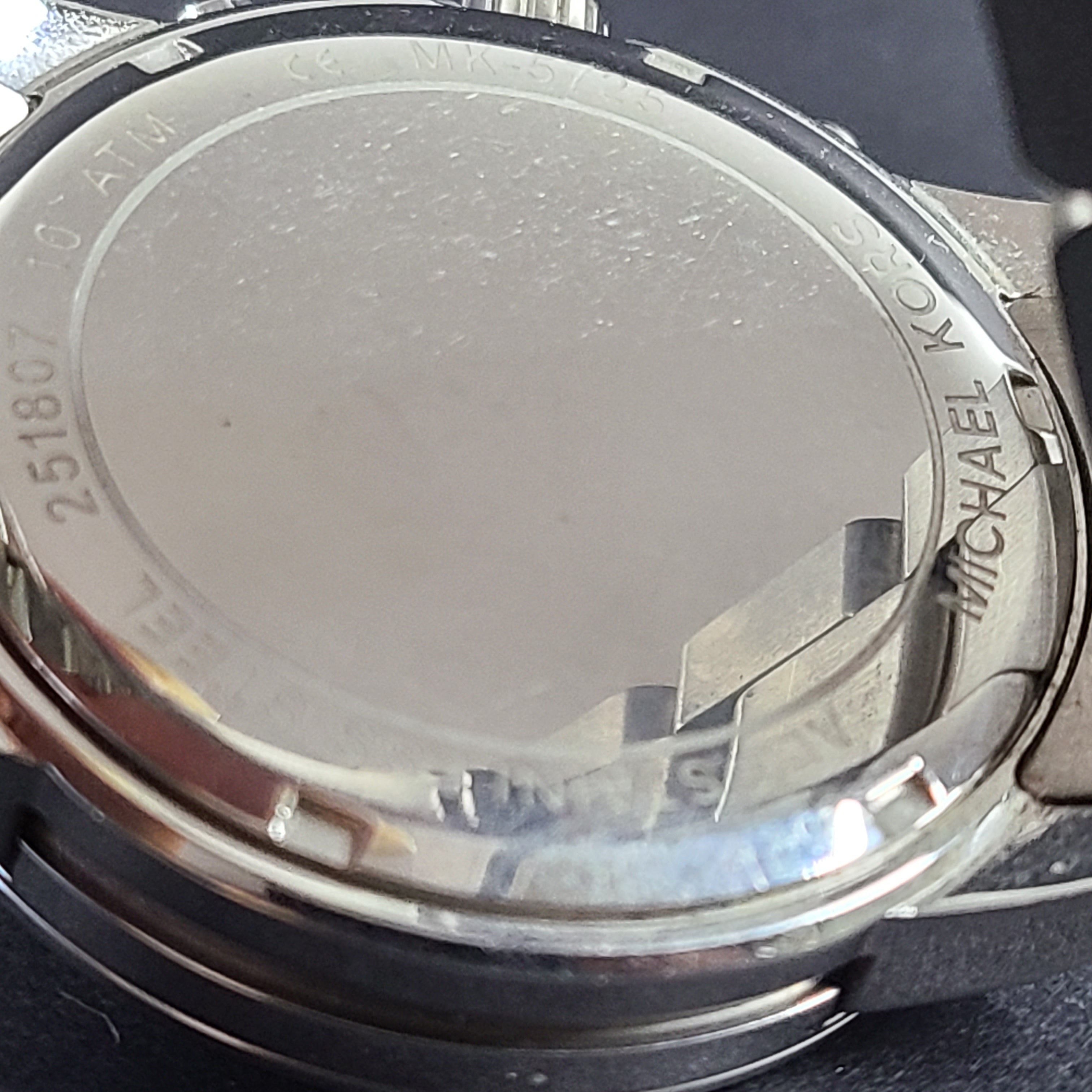 Michael Kors Mercer MK-5725 stainless steel chronograph wristwatch with a silver dial and 42mm case.
