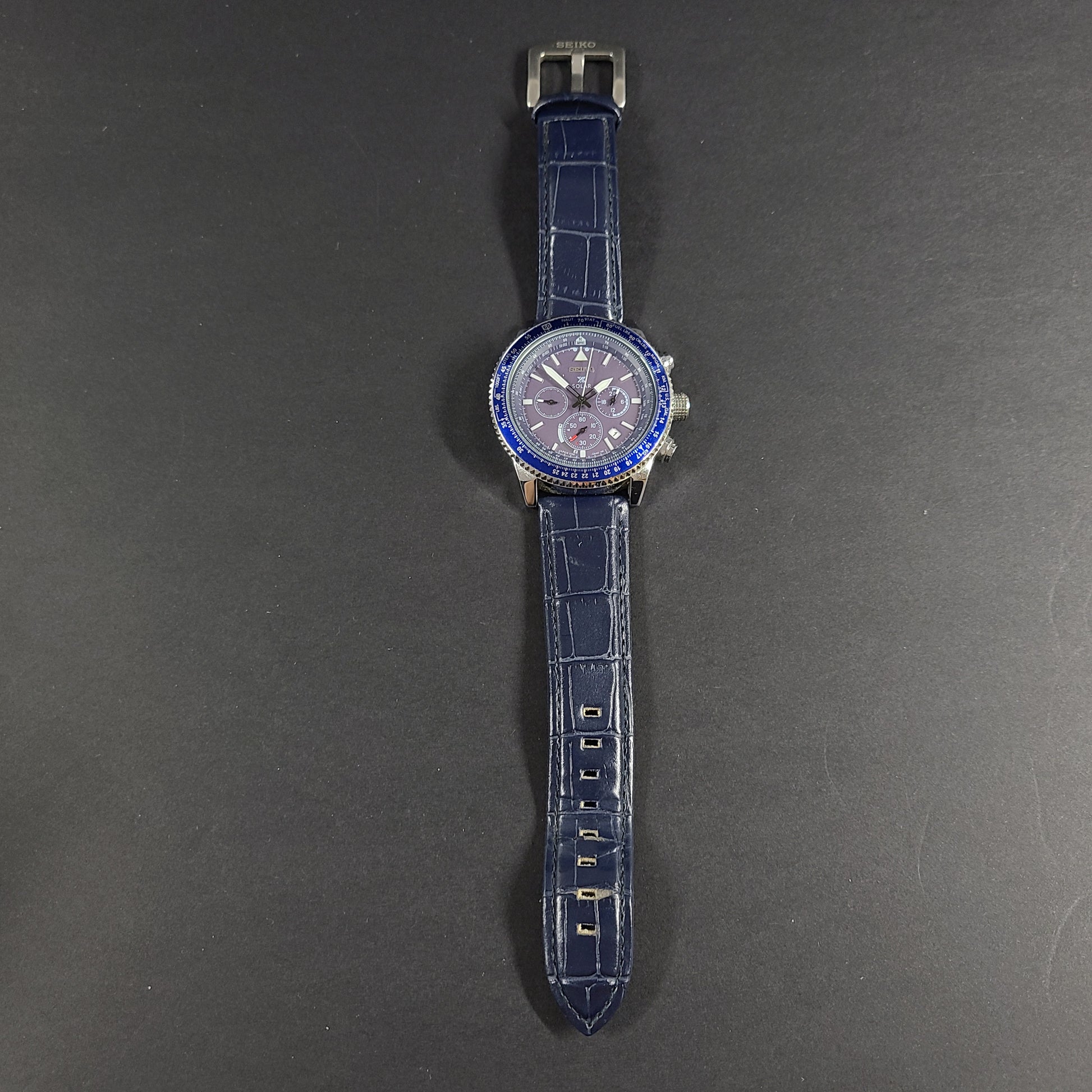 Seiko Prospex solar chronograph with blue dial and stainless steel case and bracelet.