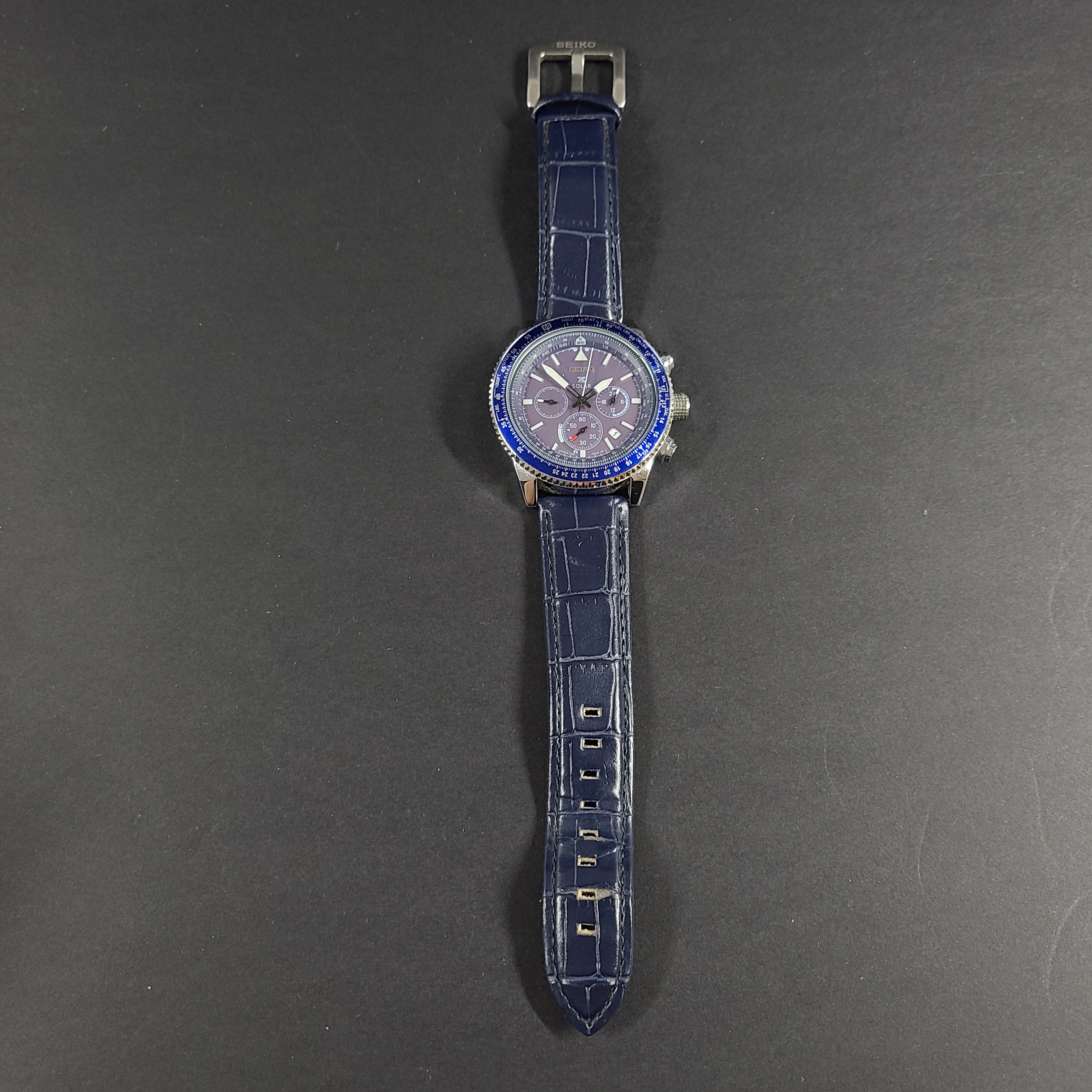 Seiko Prospex solar chronograph with blue dial and stainless steel case and bracelet.