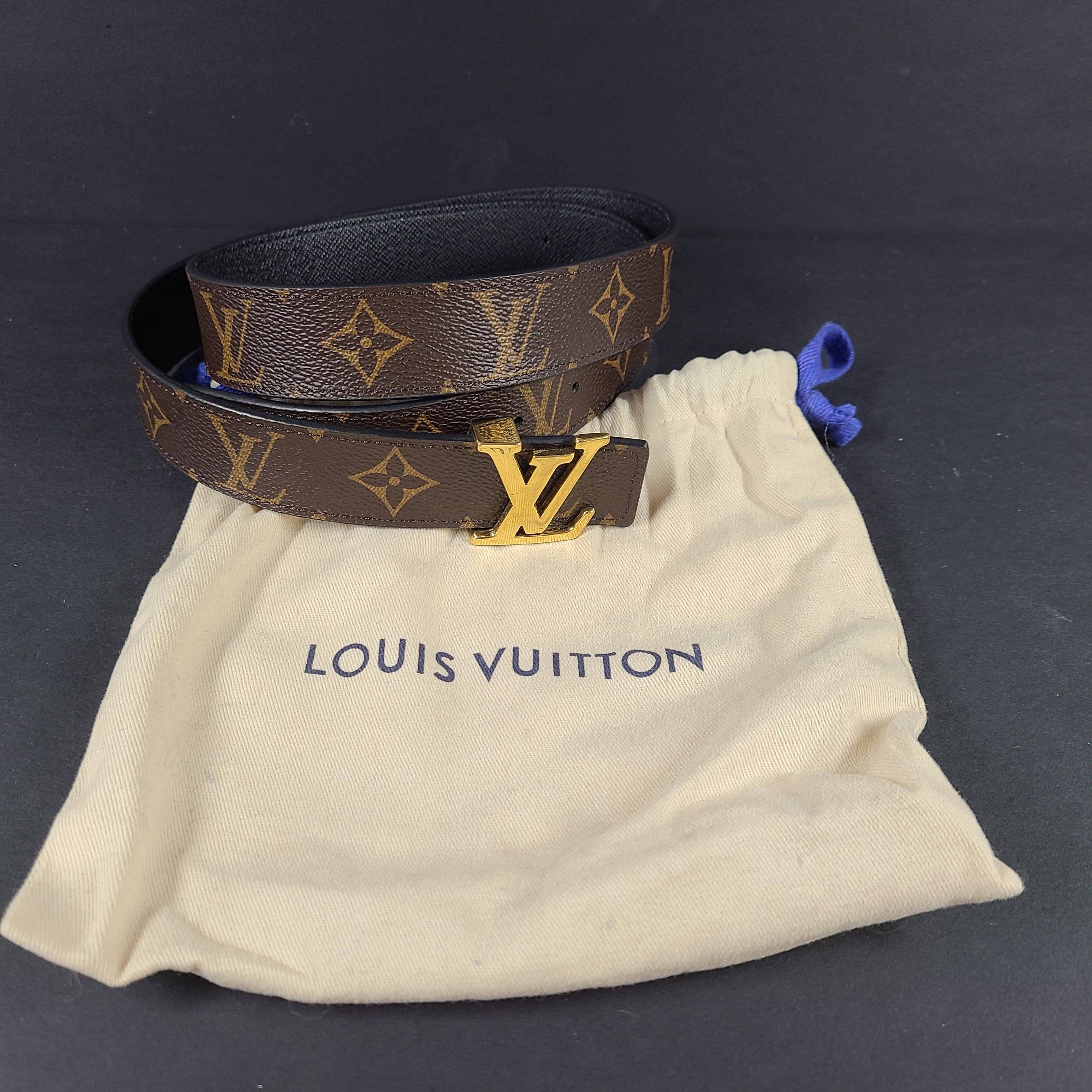 Brown Louis Vuitton monogram canvas belt with gold-tone buckle and black accents, size 34/85.