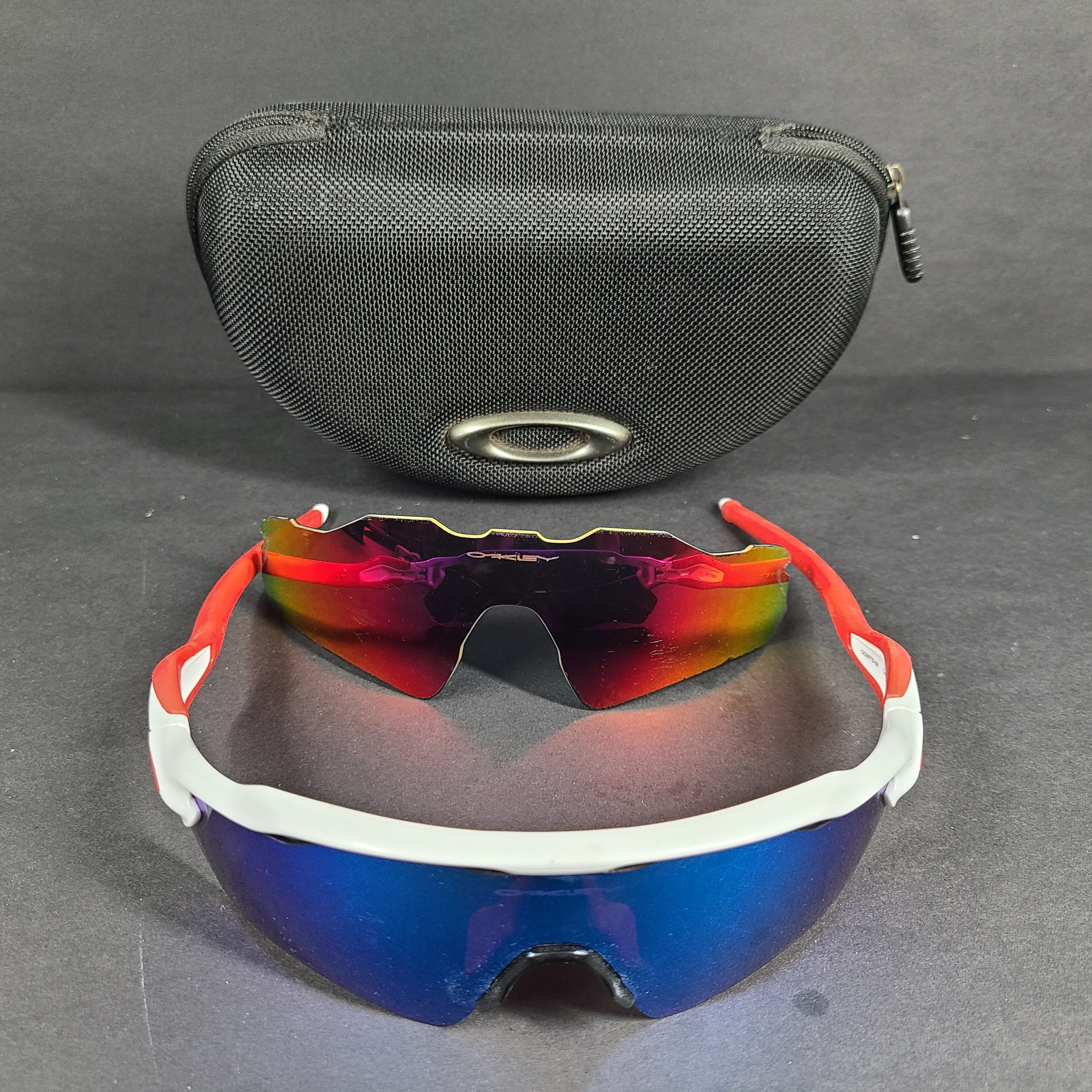 Oakley Radar EV Path lens kit with red, white and blue accents and an extra replacement lens, packaged with an original case.