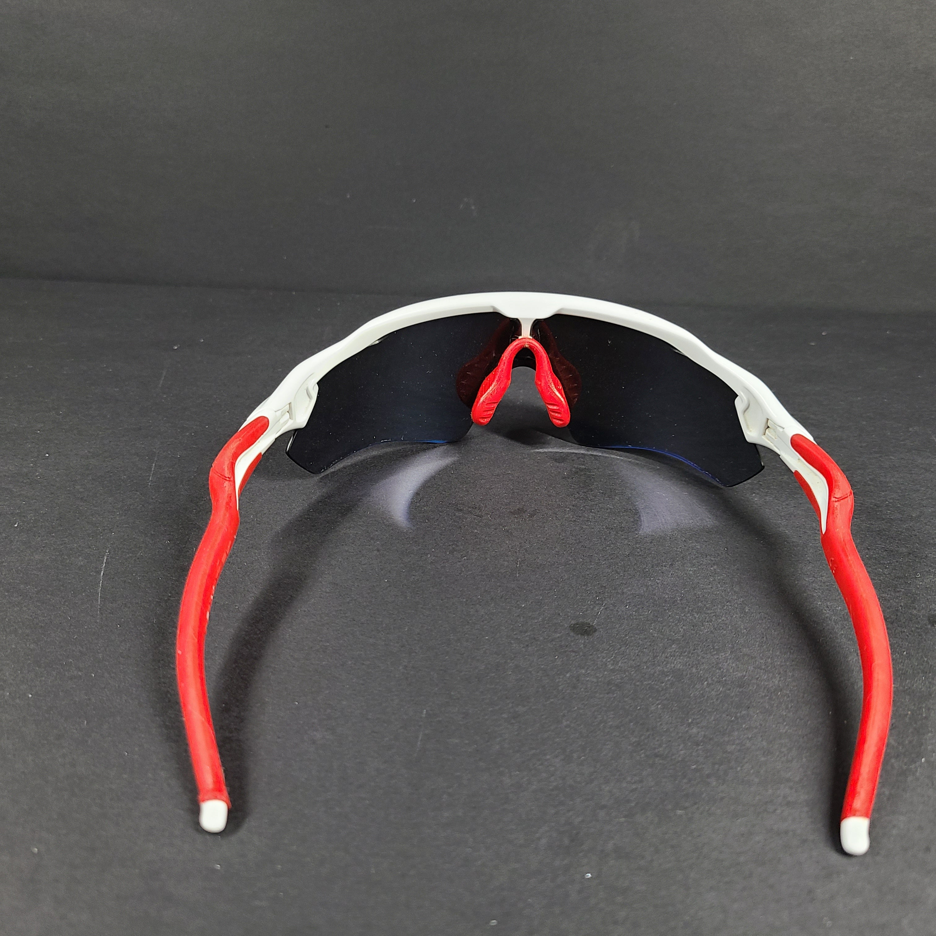 Oakley Radar EV Path lens kit with red, white and blue accents and an extra replacement lens, packaged with an original case.