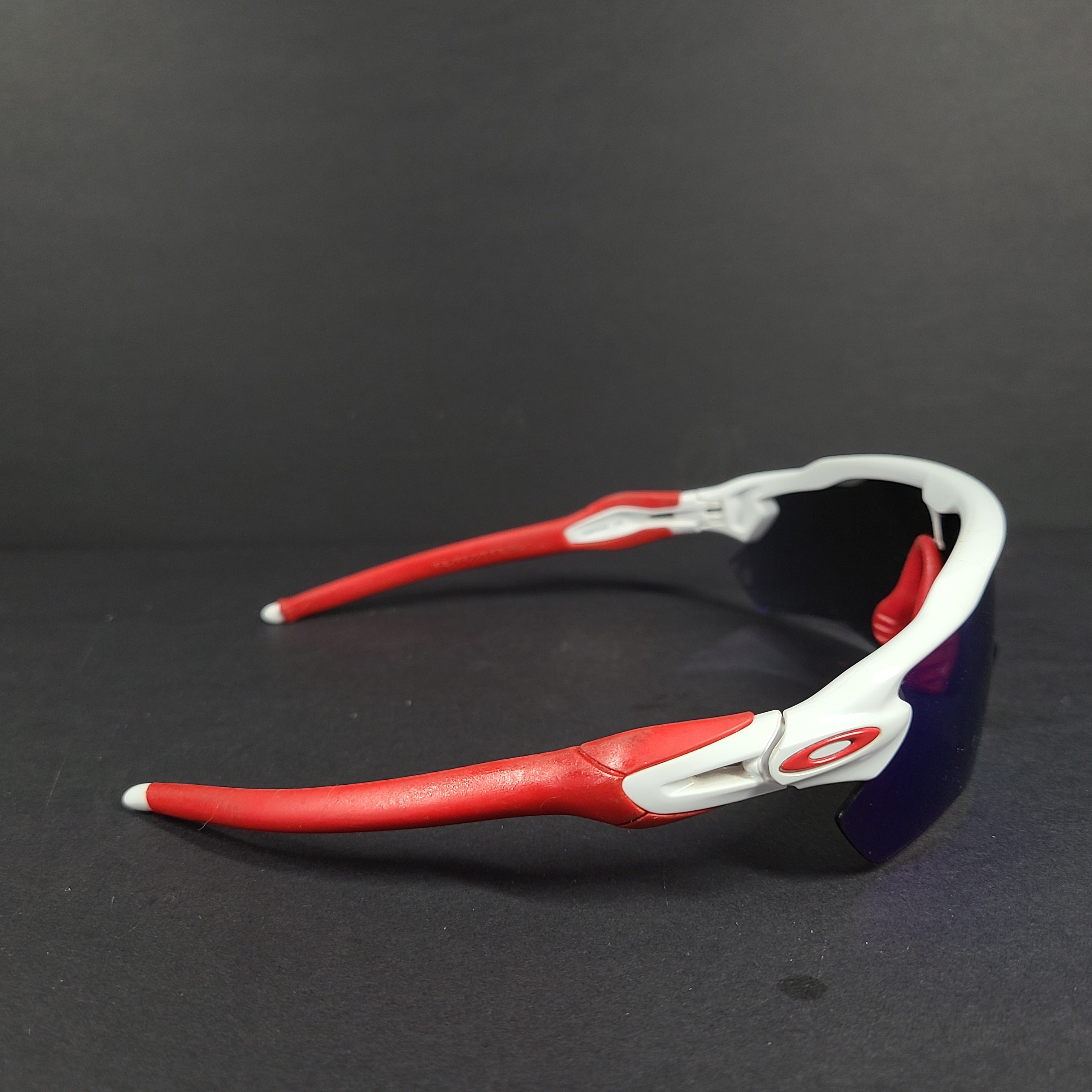 Oakley Radar EV Path lens kit with red, white and blue accents and an extra replacement lens, packaged with an original case.